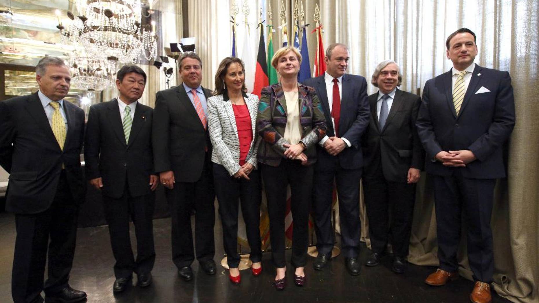 From left, EU Joint Research Centre's director general Dominique Ristori, Japan's Economy, Trade and Industry Minister Toshimitsu Motegi, Germany's Economy and Energy Minister and deputy chancellor Sigmar Gabriel, France's Ecology and Energy Minister Segolene Royal, Italy's Economic Development Minister Federica Guidi, Britain's Secretary of State for Energy and Climate Change Edward Davey, U.S. Secretary for Energy Ernest Moniz and Canada's Natural Resources Minister Greg Rickford pose for a photo on the occasion of the G7 meeting for Energy in Rome, Tuesday, May 6, 2014. (AP Photo/Riccardo De Luca)