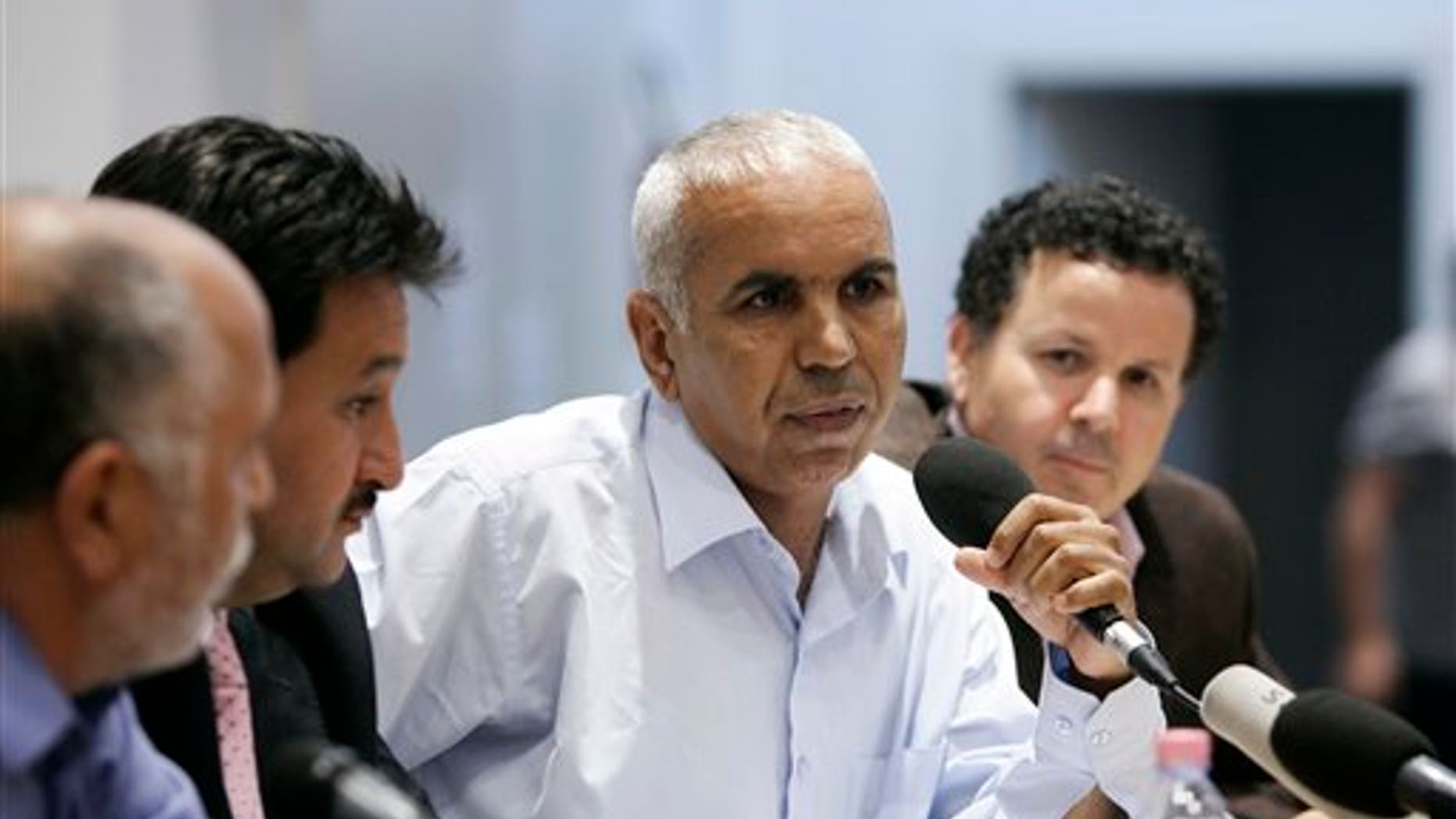 May 30: Defecting from Qaddafi's regime, Almbrok Ahmed Hmimida meets the journalists in Rome. Five Libyan army generals who defected from Muammar al-Qaddafi's side are appealing to fellow officers to join them in backing the rebels. Italian foreign ministry officials presented the generals, two colonels and a major at a news conference in Rome Monday. Gen. Melud Massoud Halasa estimates Qaddafi's forces are only 20 percent as efficient as they were before the rebellion began and that at most 10 generals are still loyal to Qaddafi. (AP)
