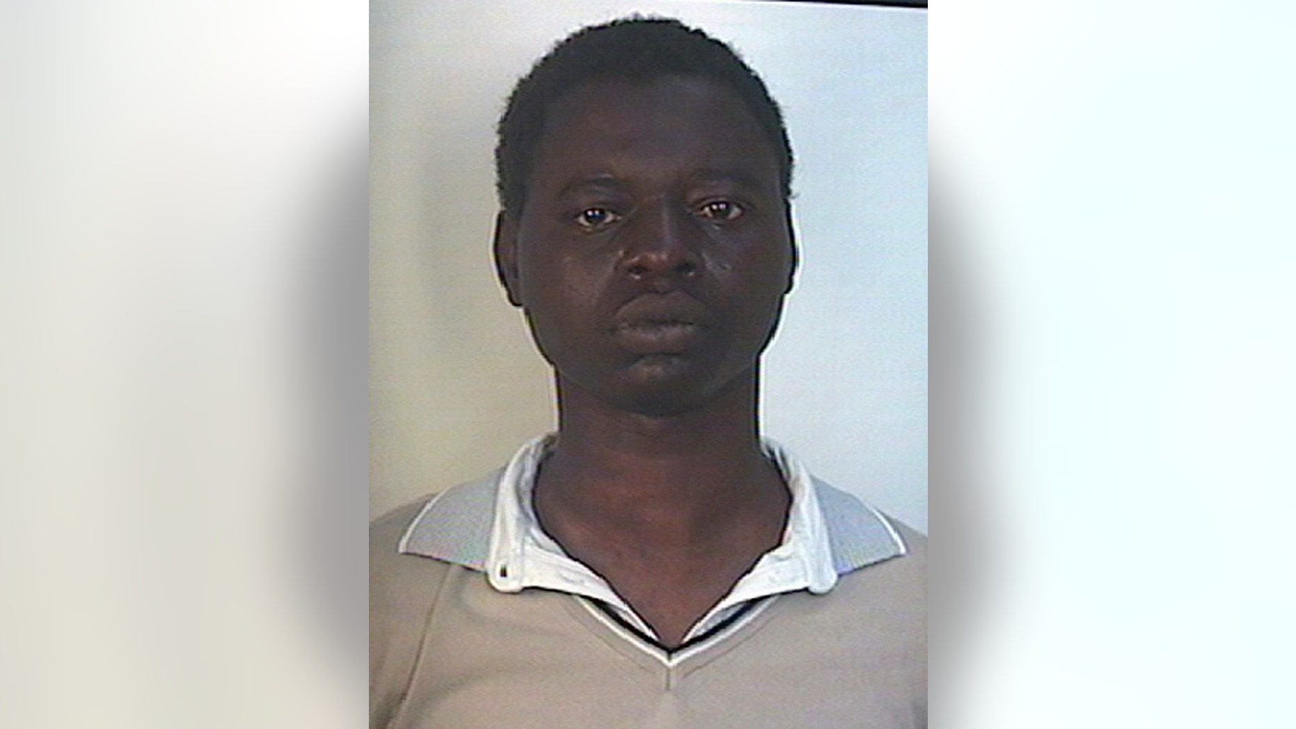 This undated photo made available Saturday, May 11, 2013 by Italian Carabinieri paramilitary police shows a man identified as Kabobo Mada, 21, from Ghana. Police say Mada, an immigrant from Ghana, went on a rampage with a pickaxe in Milan, killing a passerby and wounding four others in an apparently random attack.