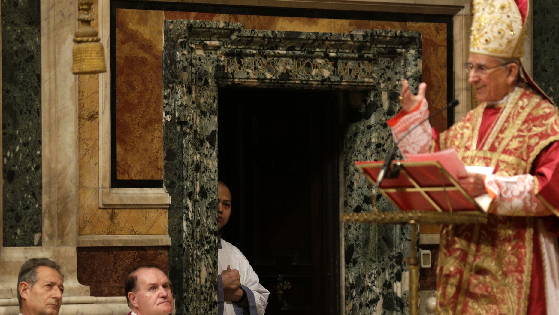 Prelates follow a mass for the election of the new pope celebrated by Cardinal Dario Castrillon Hoyos, right, inside St. Mary Major Basilica, in Rome, Friday, March 8, 2013. Cardinals have set Tuesday as the start date for the conclave to elect the next pope, signaling that they were wrapping up a week of discussions about the problems of the church and who best among them might lead it. (AP Photo/Alessandra Tarantino)