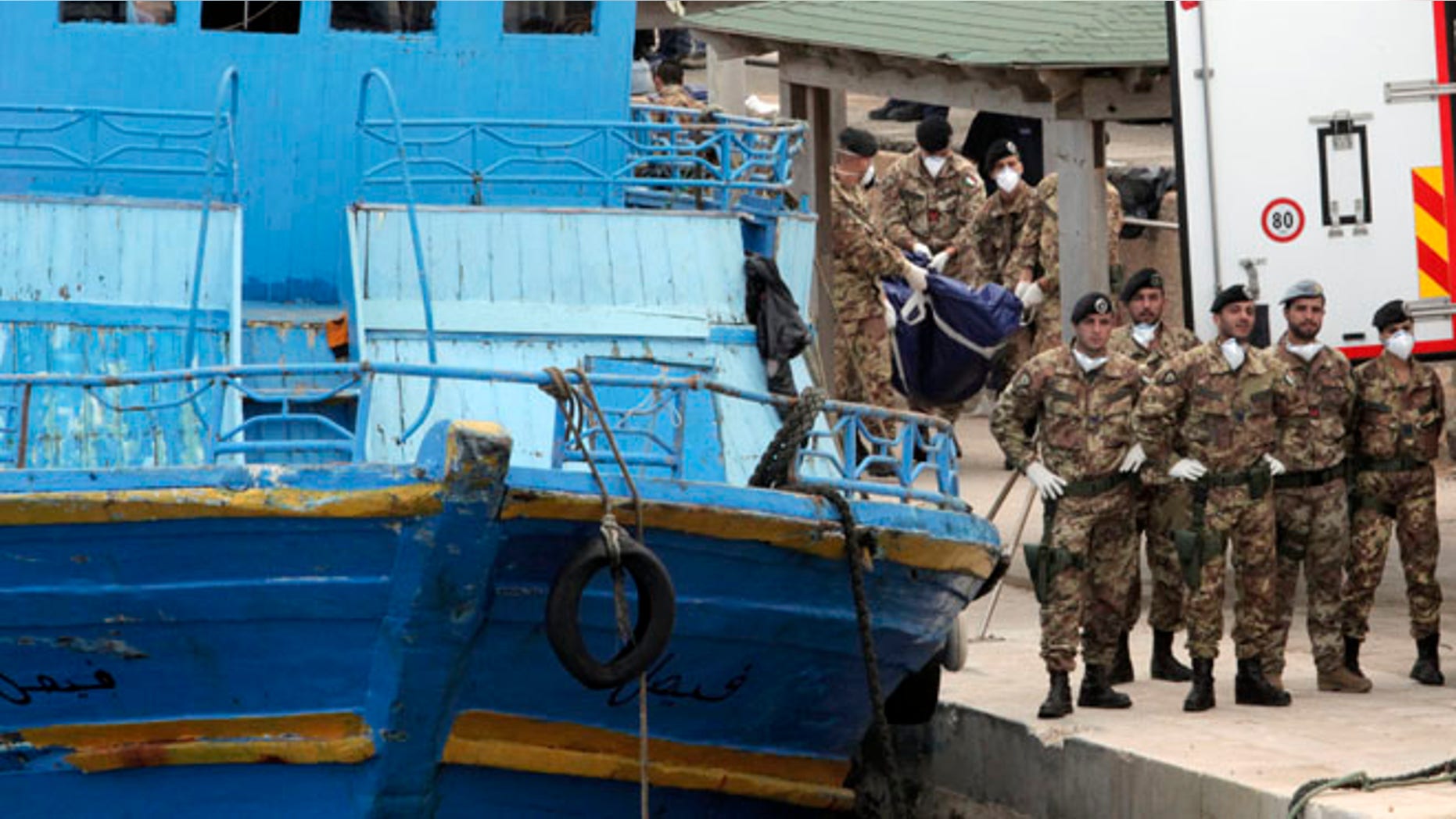 Oct. 6: Italian soldiers carry body bags at the Lampedusa island, Italy.