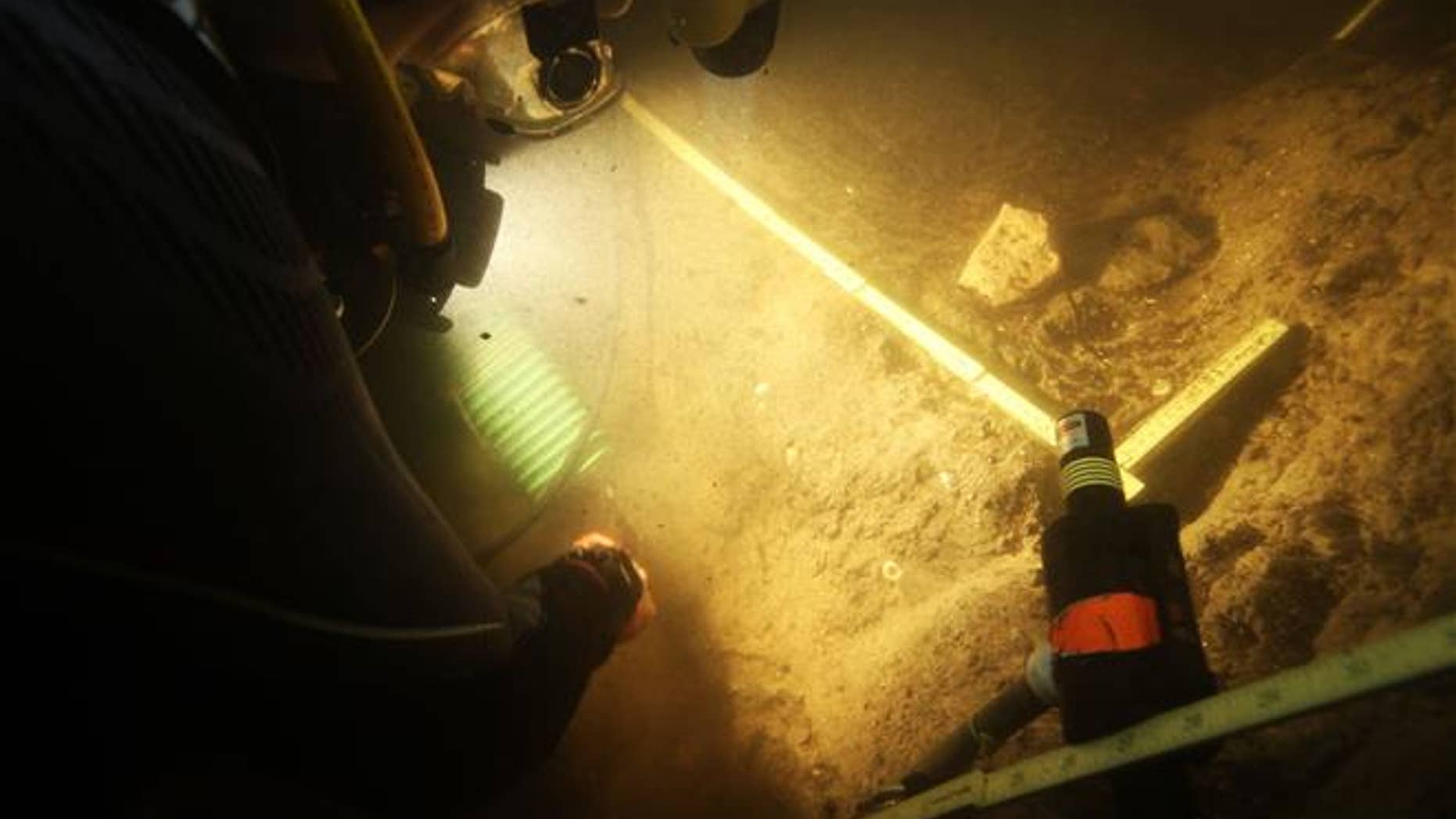 In this 2015 photo provided by Texas A&M's Center for the Study of the First Americans, divers investigate the Page-Ladson archaeological site in Florida.