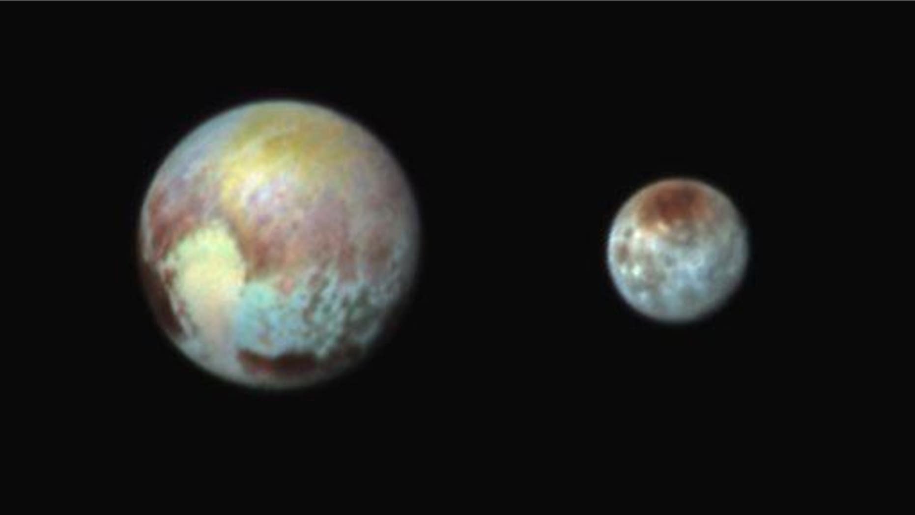This combination image released by NASA shows Pluto, left, and its largest moon, Charon.