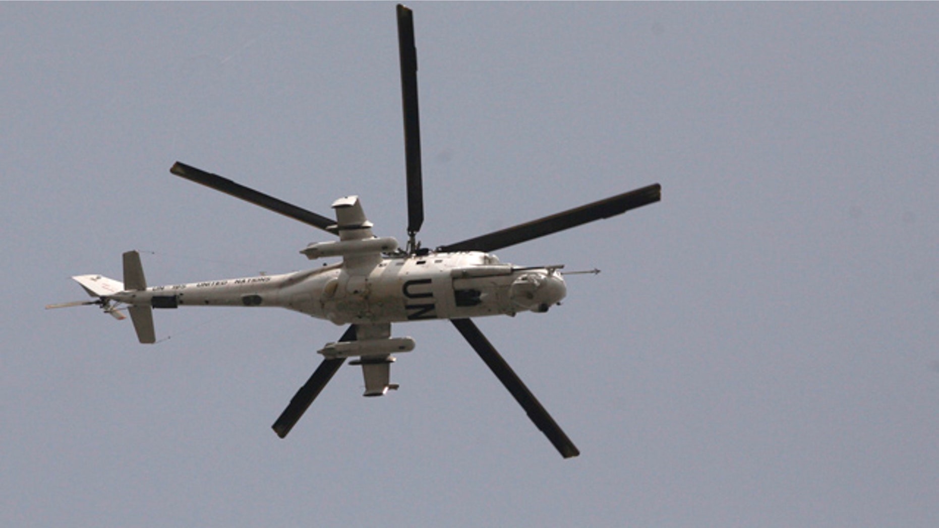 April 1, 2011: A UN helicopter passes over the city of Abidjan, Ivory Coast.