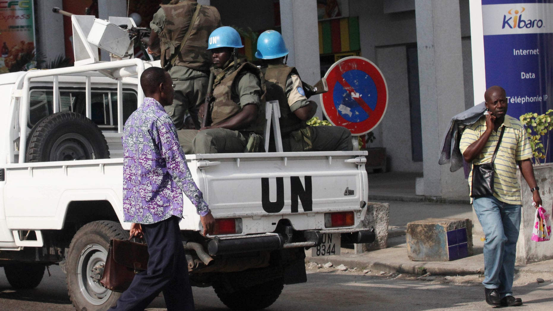 UN forces patrol on a street of, Ivory Coast, Abidjan, Wednesday, Dec. 22, 2010. The U.N. chief has warned that Ivory Coast faces "a real risk" of return to civil war, and that U.N. peacekeepers will face a critical situation in the coming days unless Laurent Gbagbo removes a blockade around his opponent's headquarters.