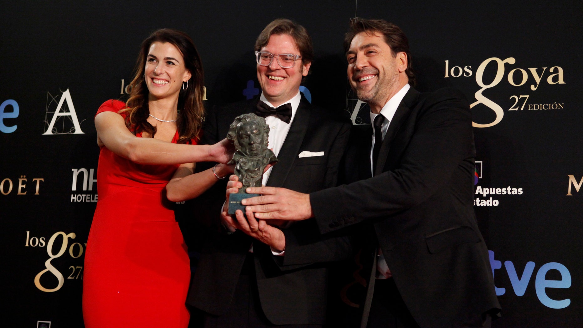 Lilly Hartley, Alvaro Longoria and Javier Bardem hold the award for Best Documentary Flim in the film "Hijos de las Nubes, La Ultima Colonia" during the 2013 edition of the Goya Cinema Awards ceremony at Centro de Congresos Principe Felipe in Madrid, Spain.