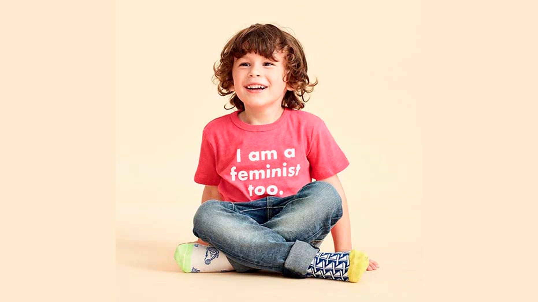 J.Crew posted a photo on Friday that featured a young male model in the controversial pink, feminist-focused T-shirt.