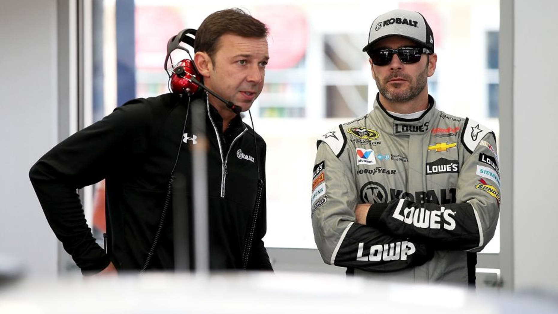 LAS VEGAS, NV - MARCH 03: (L-R) Crew Chief Chad Knous talks with Jimmie Johnson, driver of the #48 Kobalt Chevrolet, in the garage during Testing at Las Vegas Motor Speedway on March 3, 2016 in Las Vegas, Nevada. (Photo by Sean Gardner/NASCAR via Getty Images)
