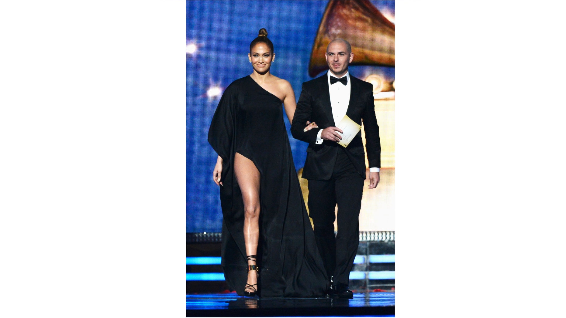 LOS ANGELES, CA - FEBRUARY 10: Singers Jennifer Lopez and Pitbull speak onstage at the 55th Annual GRAMMY Awards at Staples Center on February 10, 2013 in Los Angeles, California. (Photo by Kevork Djansezian/Getty Images)