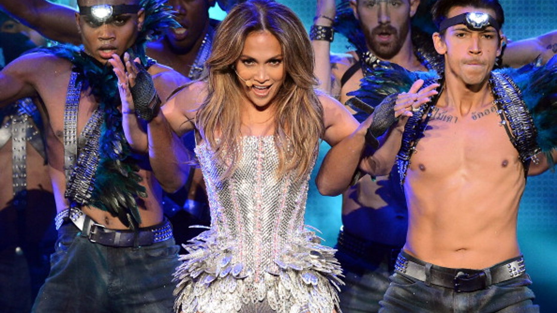 Singer/actress Jennifer Lopez performs with dancers during her ongoing "Dance Again" world tour.