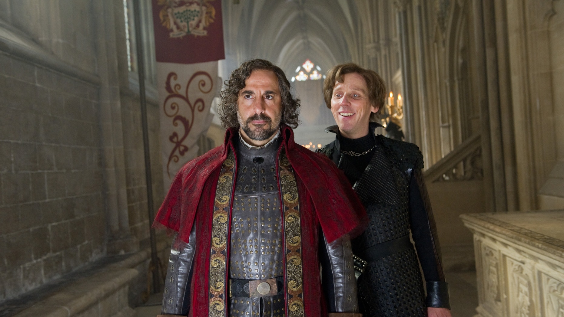 This film image released by Warner Bros. Pictures shows Stanley Tucci, left, and Ewen Bremner in a scene from "Jack the Giant Slayer."