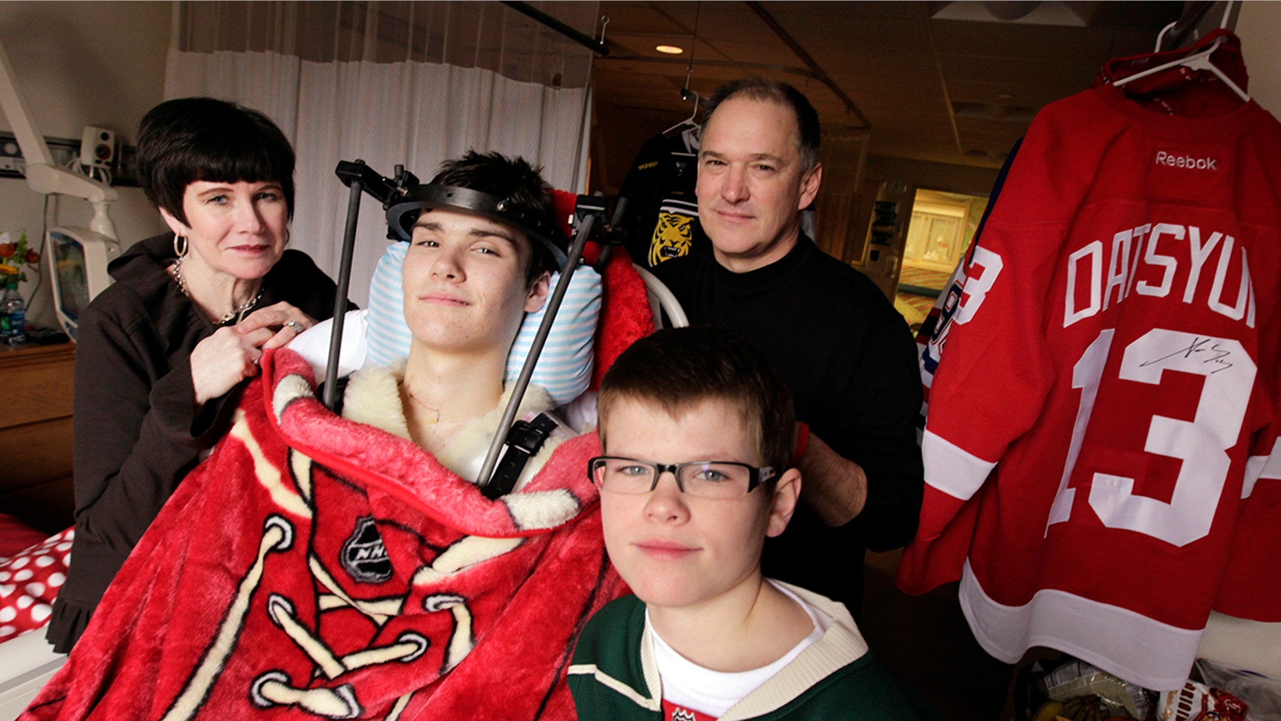 Jack Jablonski with his mother, Leslie, father Mike, and brother Max, at Hennepin County Medical Center in Minneapolis.