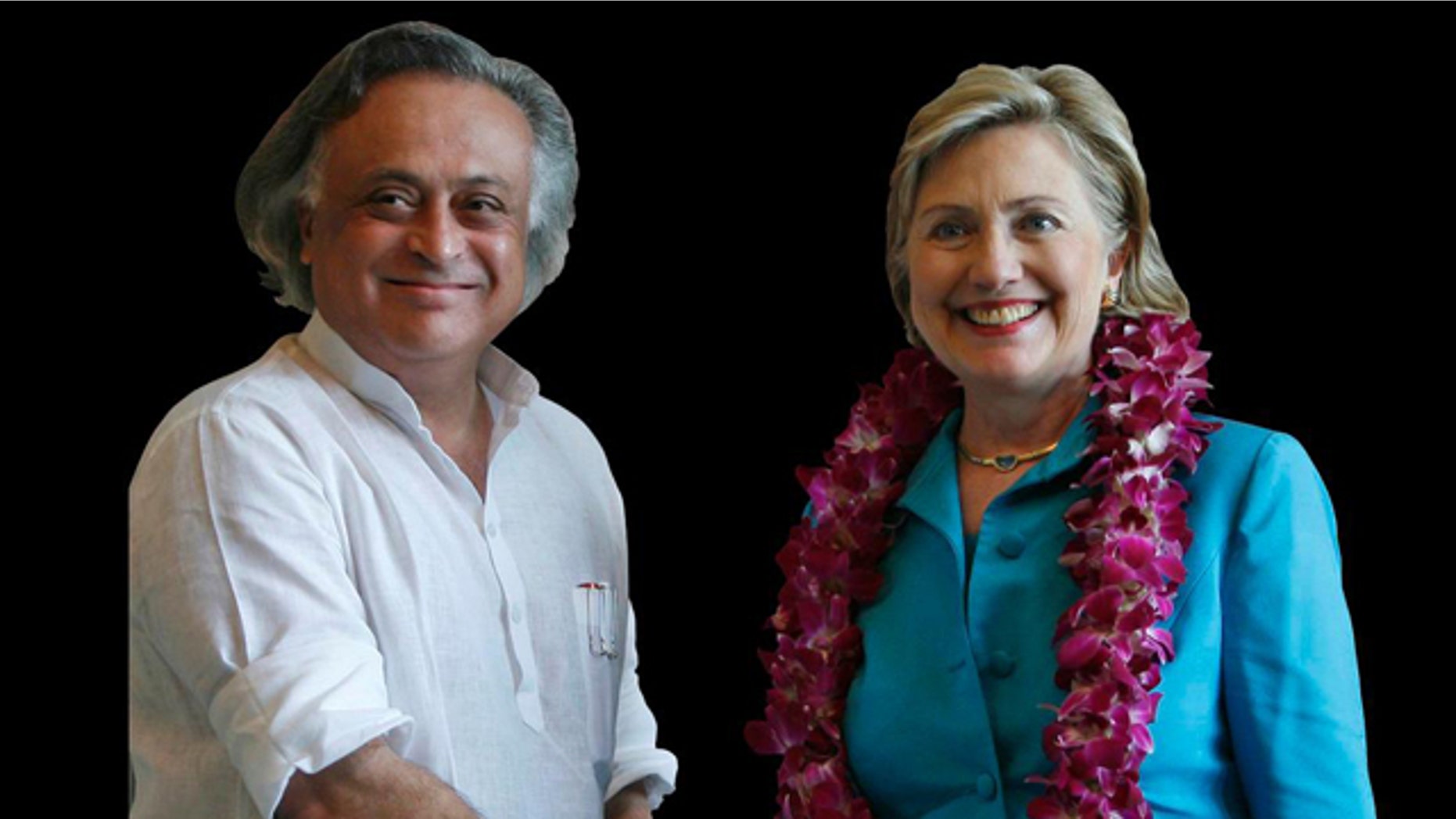 Jairam Ramesh, India's Junior Minister for Environment and Forests, and Hillary Rodham Clinton, US Secretary of State, shake hands in New Delhi, India.