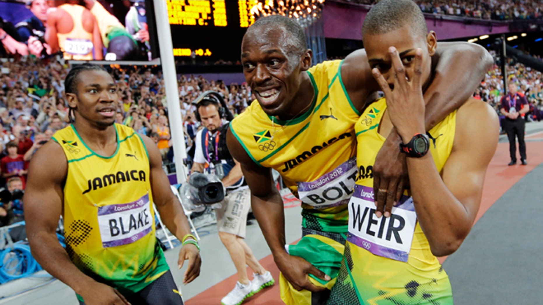 Aug. 9, 2012: Jamaica's Usain Bolt, center, celebrates with teammates Yohan Blake, left, and Warren Weir after they swept the men's 200-meter final at the London Olympics.