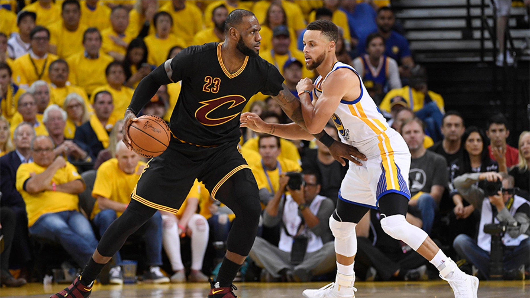 Cleveland Cavaliers forward LeBron James (23) is defended by Golden State Warriors guard Stephen Curry (30) during the third quarter in game five of the 2017 NBA Finals at Oracle Arena.