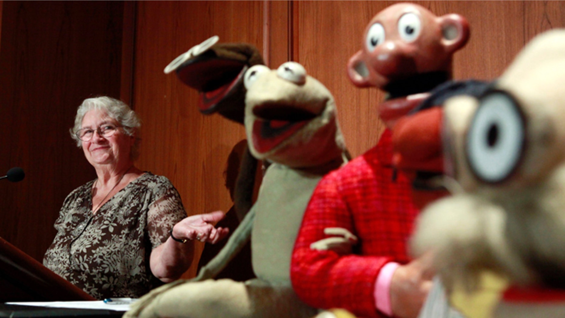 Aug. 25, 2010: In this photo, Jane Henson, left, donates some of Jim Henson's early puppets, including the original Kermit, to the Smithsonian Institution, during a ceremony at the National Museum of American History, in Washington.