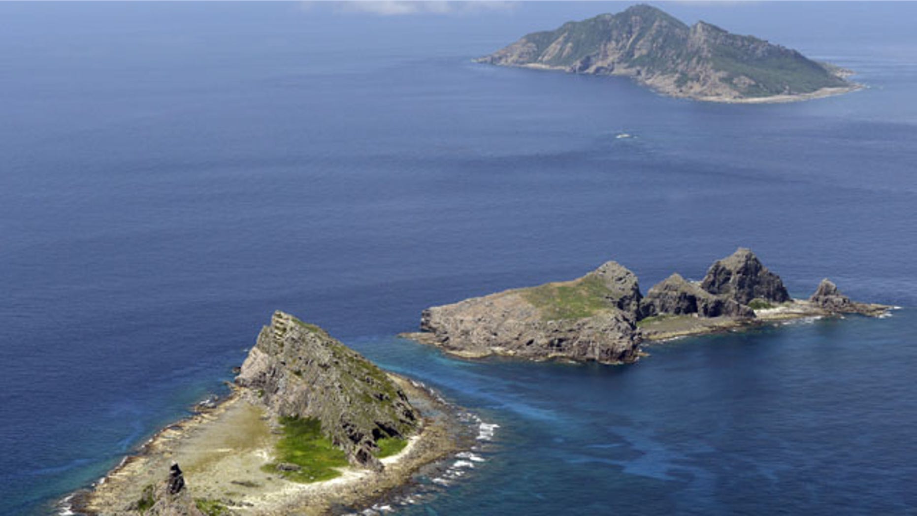 In this Sept. 2012 photo, the tiny islands in the East China Sea, called Senkaku in Japanese and Diaoyu in Chinese are seen. (AP Photo/Kyodo News)