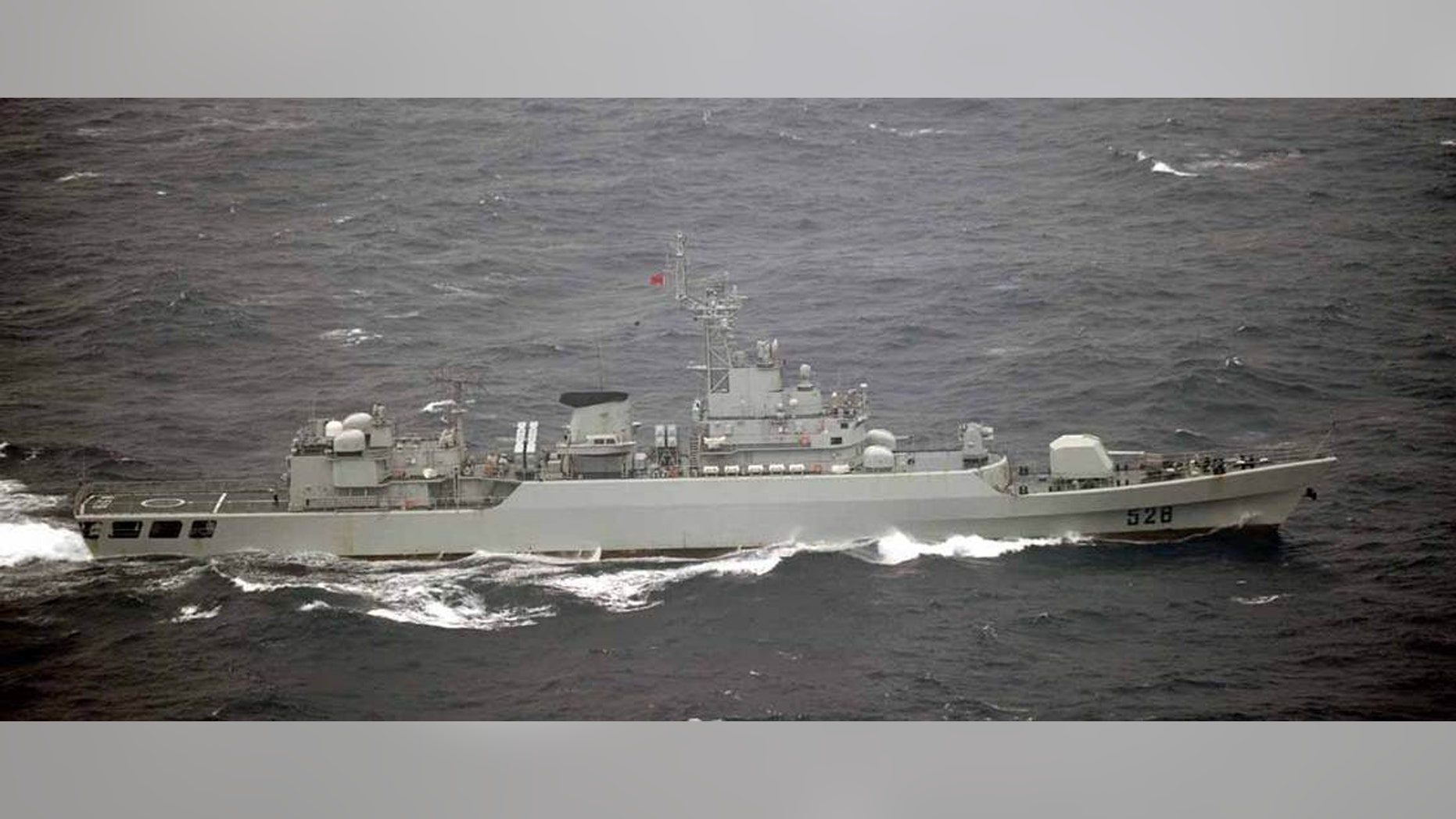 In this photo released by Japan's Joint Staff Office, a Chinese frigate sails in waters off the island of Yonaguni in Japan's Okinawa prefecture on Tuesday, Oct. 16, 2012. Japanese aircraft spotted seven Chinese warships in waters off the southern Japan island and about 200 kilometers (125 miles) from the uninhabited isles at the center of a territorial dispute between the two countries. (AP Photo/Joint Staff Office)