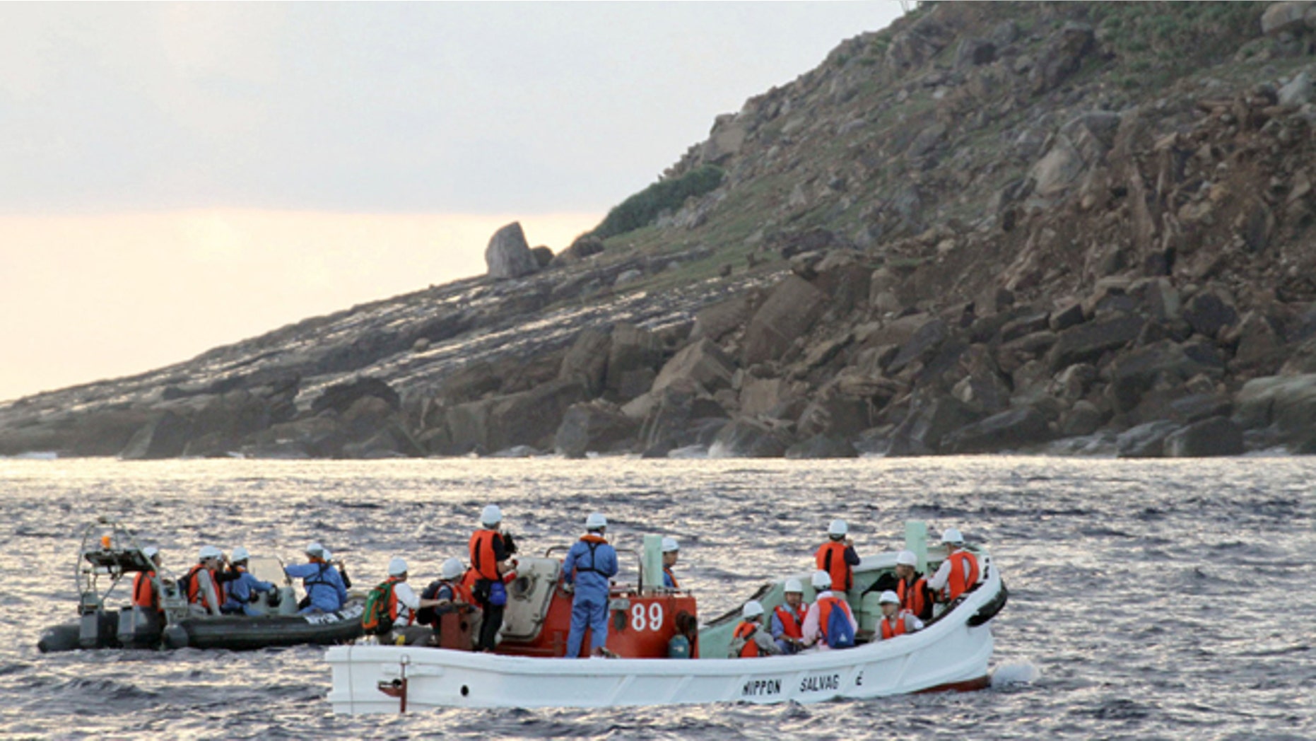 Sept. 2, 2012: Tokyo city officials and experts survey Uotsuri Island, one of the islands of Senkaku in Japanese and Diaoyu in Chinese, in the East China Sea.