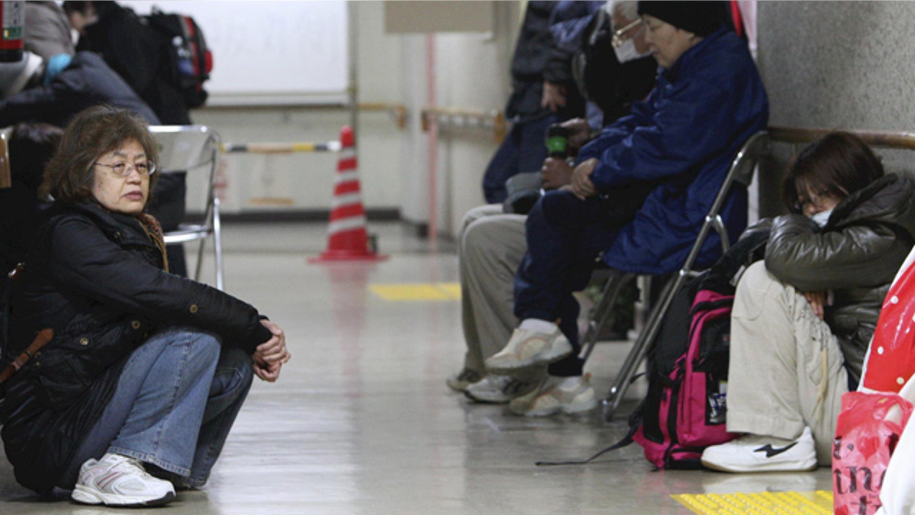 April 8, 2011: Evacuees with their belongings gather at the lobby of their shelter in Sendai, Miyagi Prefecture, northeastern Japan.