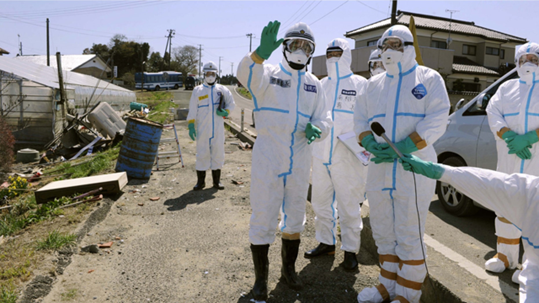 April 17: Chief Cabinet Secretary Yukio Edano, second right, gets briefed during his inspection in Minamisoma, Fukushima Prefecture, Japan.