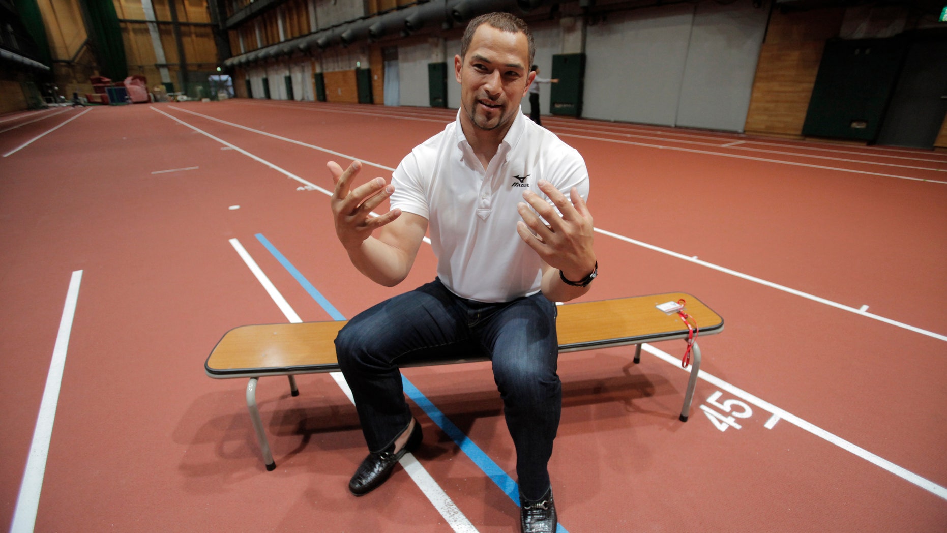 June 12, 2012: In this photo, Japan's hammer thrower for London Olympics, Koji Murofushi speaks during an interview with the Associated Press in Tokyo.