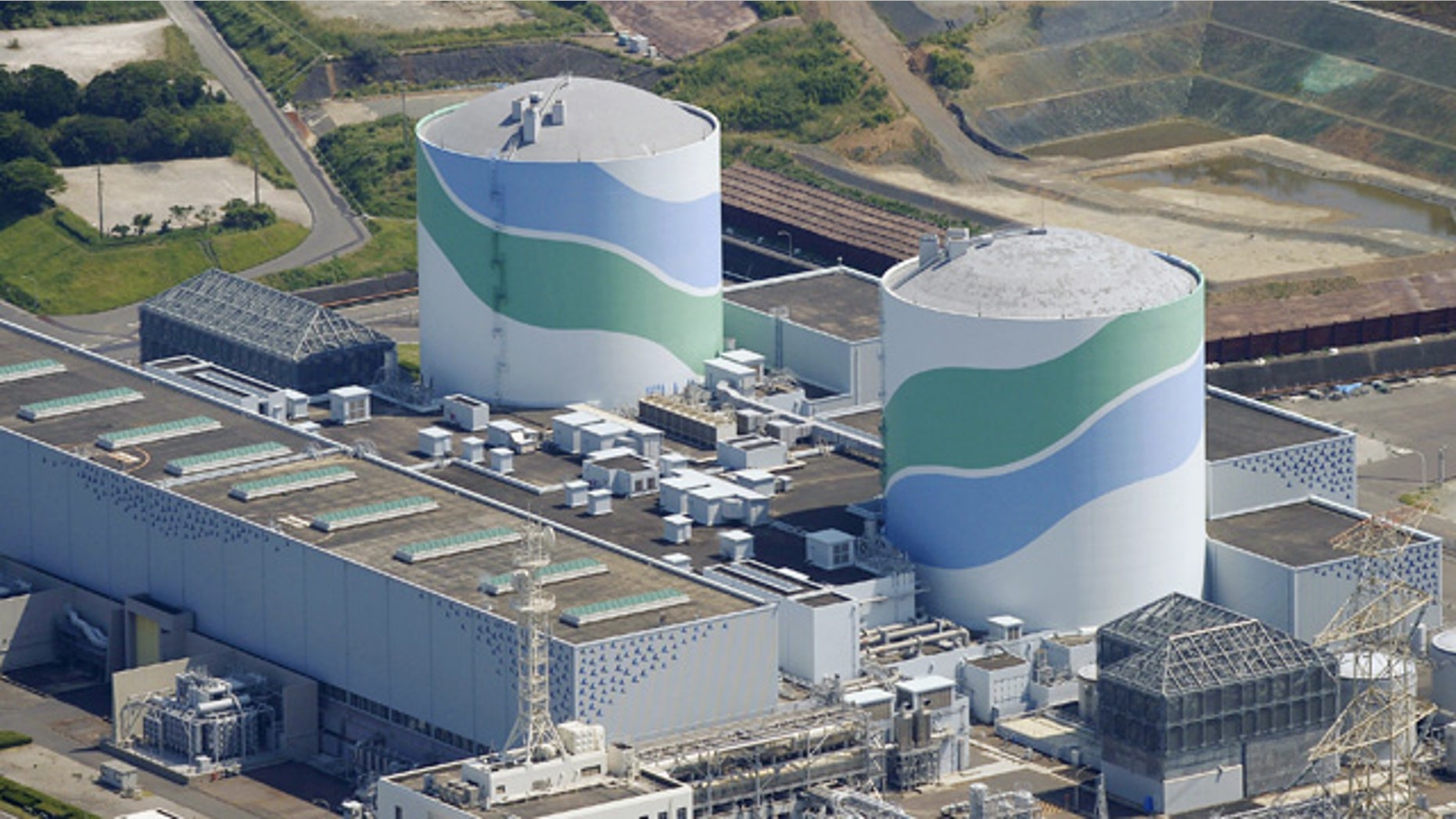 Aug. 11, 2015: This aerial photo shows reactors of No. 1, right, and No. 2, left, at the Sendai Nuclear Power Station in Satsumasendai, Kagoshima prefecture, southern Japan. (Kyodo News via AP)