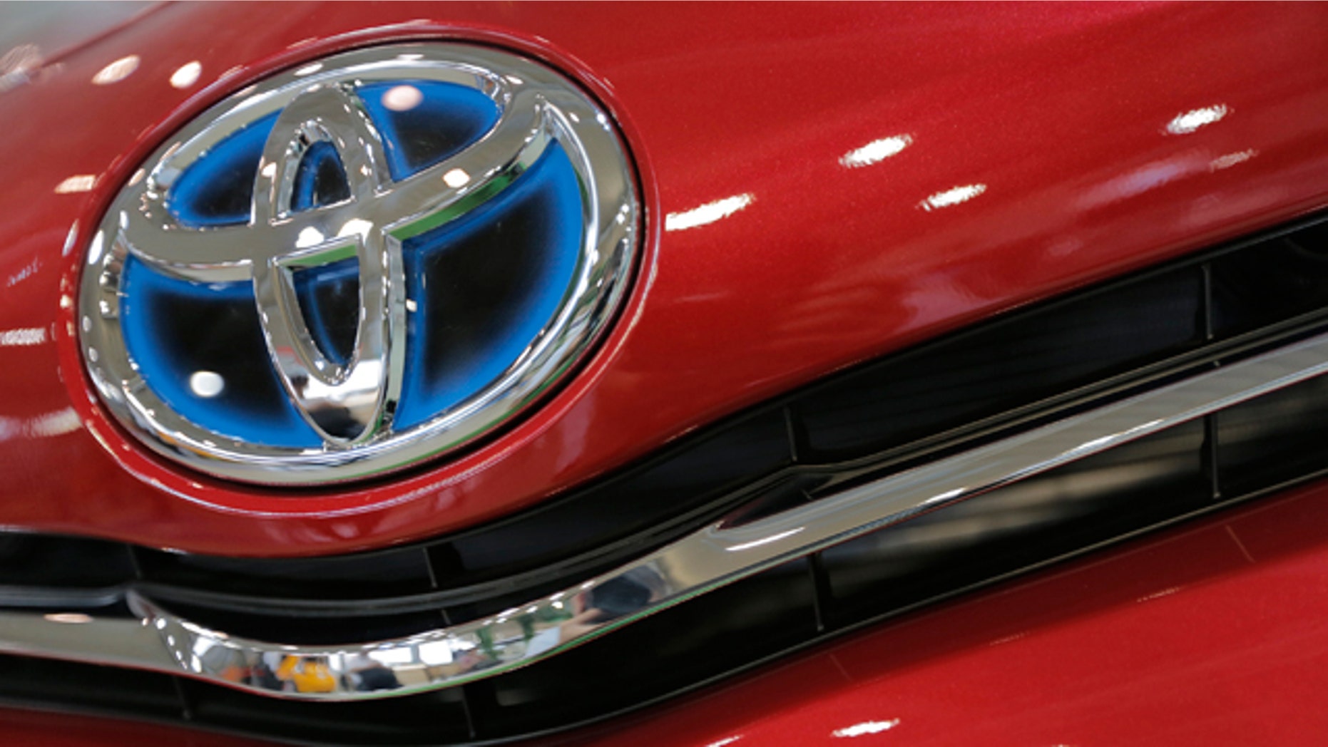 August 2, 2013: The emblem of a Toyota car shines at Toyota Motor Corp.'s showroom Toyota Mega Web in Tokyo. (AP Photo/Itsuo Inouye, File)