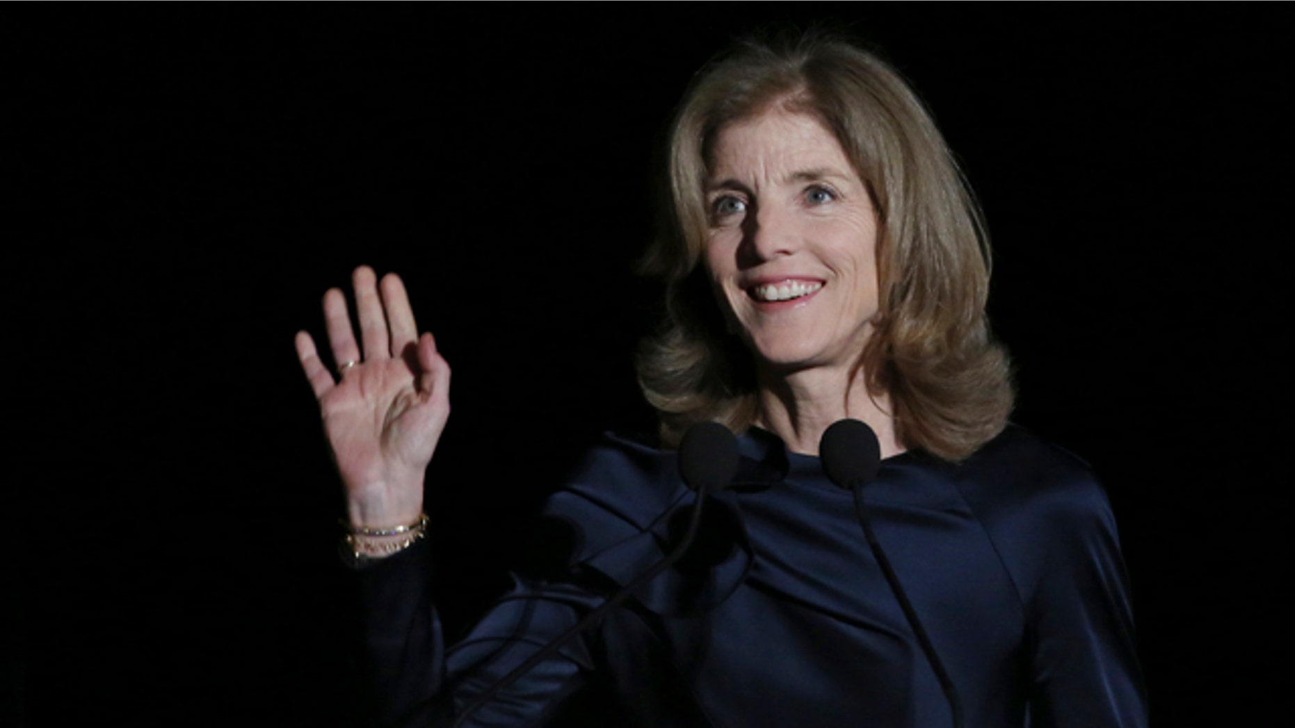 March 18, 2015: U.S. Ambassador to Japan Caroline Kennedy waves before she delivers opening remarks during JFK International Symposium at Waseda University in Tokyo. (AP Photo/Eugene Hoshiko)