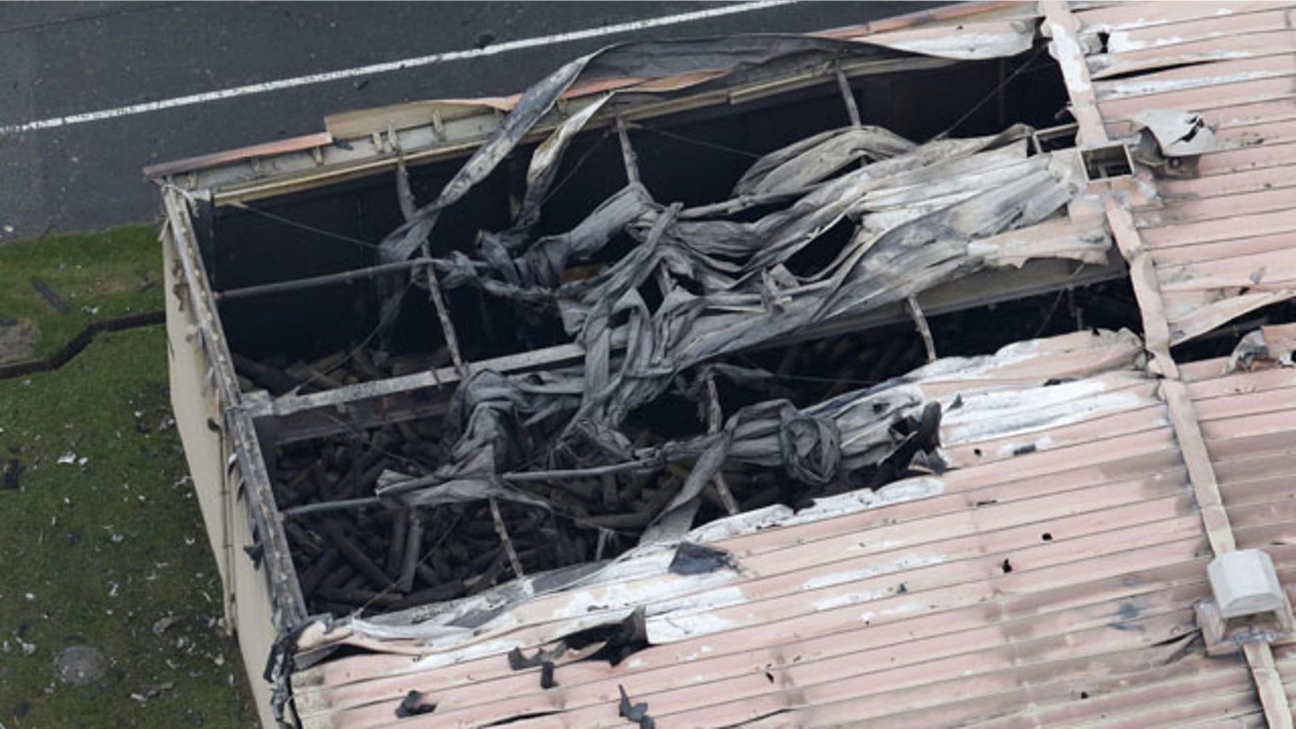 Aug. 24, 2015: U.S. Army Sagami Depot in Sagamihara, southwest of Tokyo is damaged after multiple explosions and a large fire. (Kyodo News via AP)