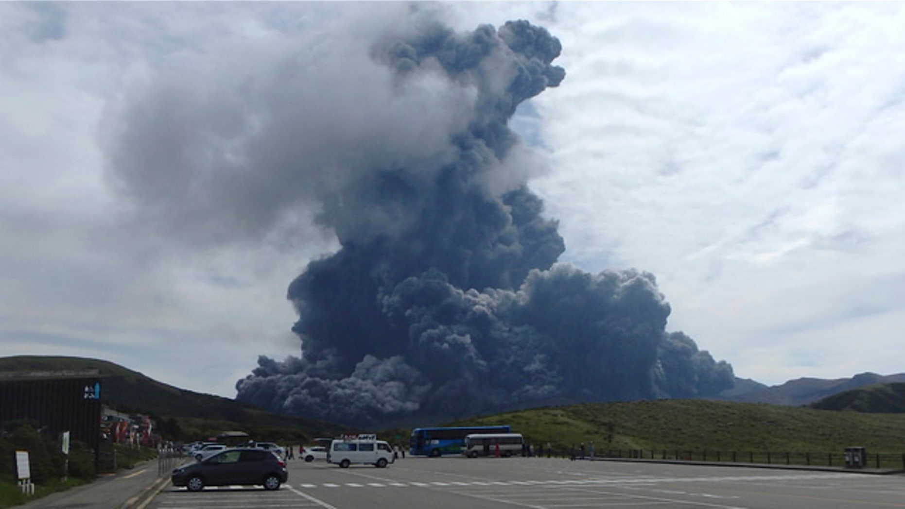 Sept. 14, 2015: In this photo released by Aso Volcano Museum, a column of black smoke rises from Mount Aso on the southern Japanese island of Kyushu. (Aso Volcano Museum via AP)