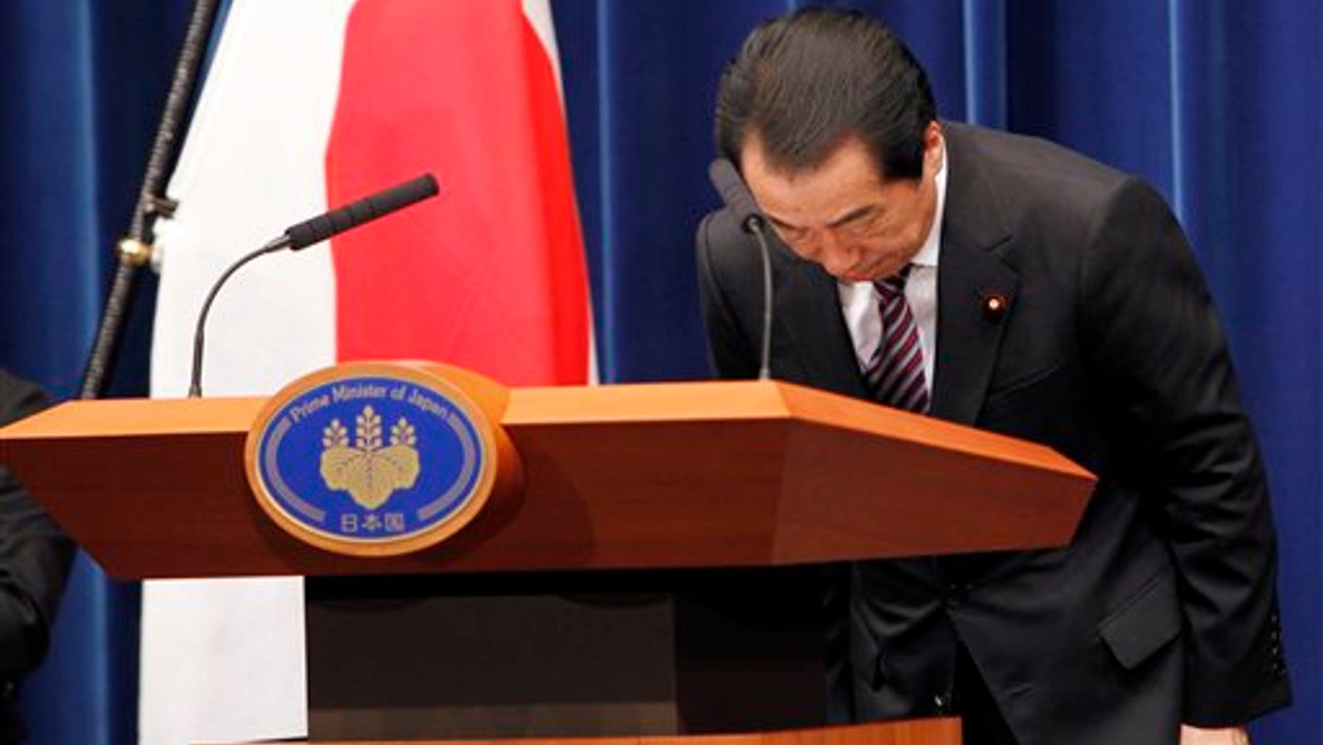 August 26: Japanese Prime Minister Naoto Kan bows during a press conference at his official residence in Tokyo, Japan.