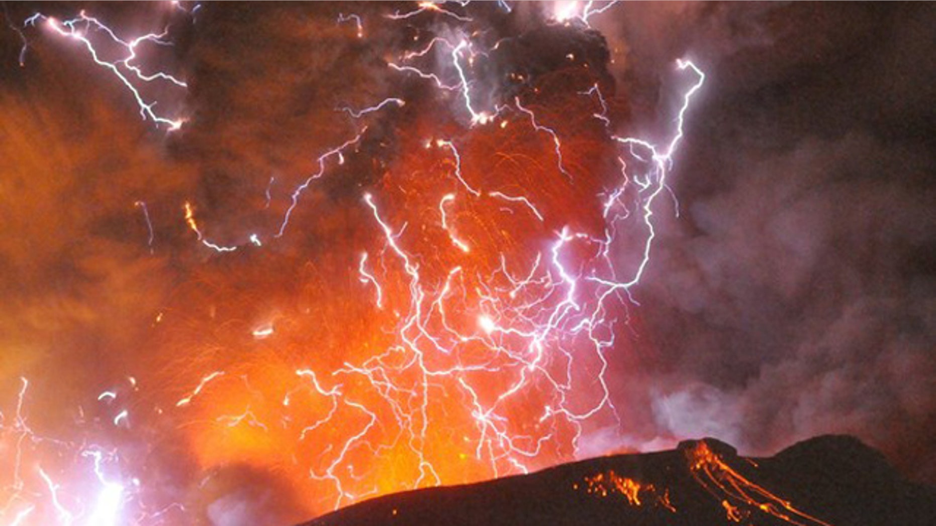Jan. 28: Volcanic lightning or a dirty thunderstorm is seen above Shinmoedake peak as it erupts, between Miyazaki and Kagoshima prefectures, in this photo taken from Kirishima city and released by Minami-Nippon Shimbun.