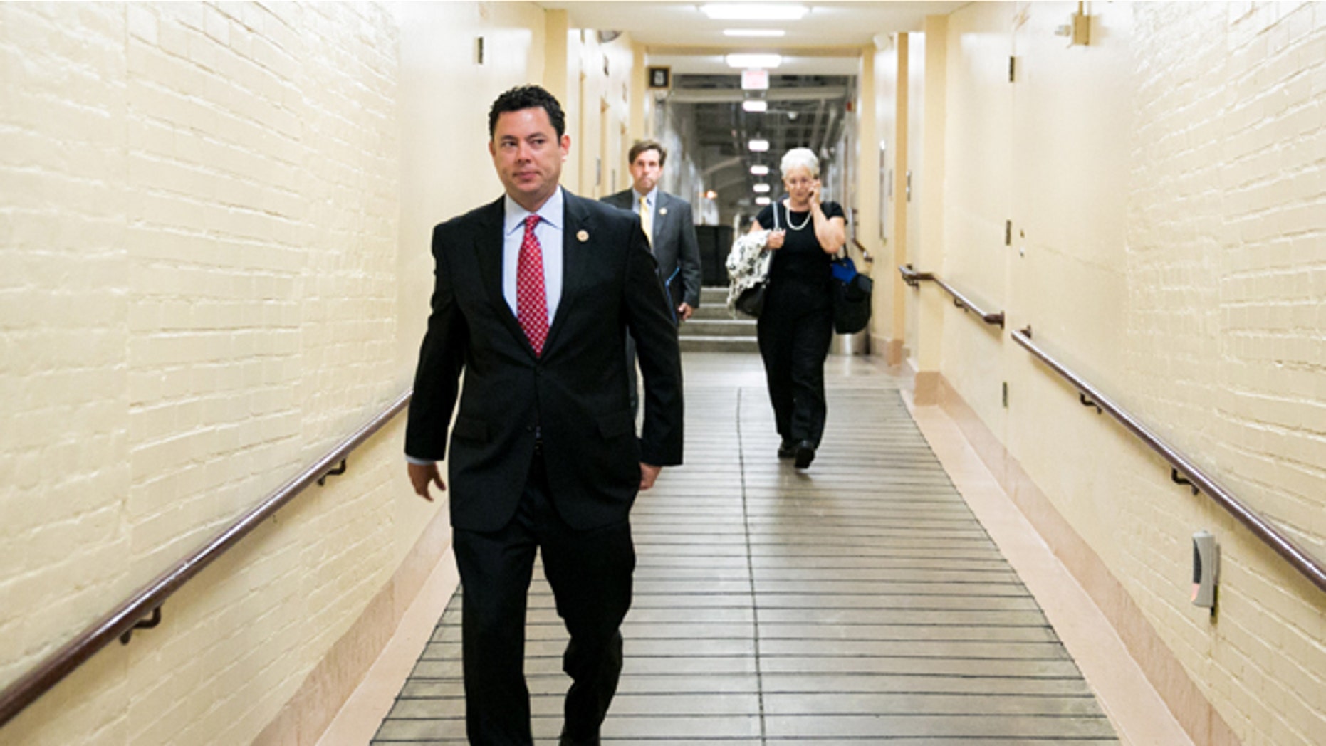 WASHINGTON, DC - JULY 9: U.S. Rep. Jason Chaffetz (R-UT) makes his way to a House GOP caucus meeting, on Capitol Hill, July 9, 2013 in Washington, DC. The Republican leadership discussed the immigration bill and the Obama administration's decision to delay a portion of the Affordable Care Act, which will extend the deadline for employer mandated health care to 2015. At right, Trey Radel (R-FL) and House Majority Leader Eric Cantor (R-VA) look on. (Photo by Drew Angerer/Getty Images)