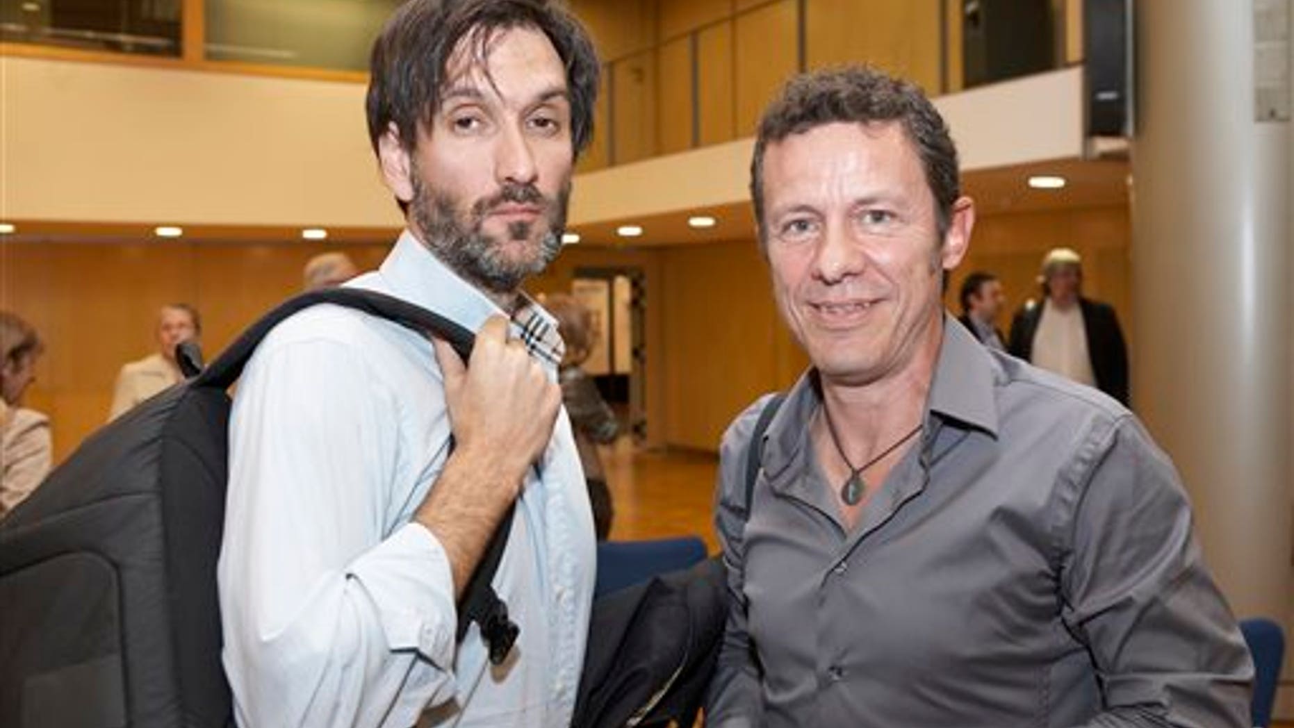 FILE - In this file photo taken on May 24, 2012, Spanish reporters Javier Espinosa, right, and Ricardo Garcia Vilanova, left, pose for a photo during the ceremony of the Miguel Gil journalisms awards in Barcelona, Spain. The two Spanish journalists were freed after being held captive for six months in Syria by a rogue al-Qaida group, the newspaper for which one of the men worked said Sunday March 30, 2014. Espinosa and Vilanova were held since September by the breakaway group, the Islamic State in Iraq and the Levant, who detained them at a checkpoint in the town of Tal Abyad in the eastern province of Raqqa, where the militants dominate. The two were trying to leave Syria at the time. (AP Photo/Joan Borras, file)