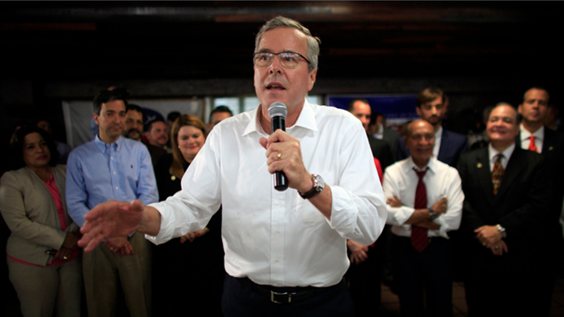 FILE - In this April 28, 2015 file photo, former Florida Gov. Jeb Bush speaks during a town hall meeting with Puerto Rico's Republican Party in Bayamon, Puerto Rico. Bush on Wednesday declared that 11 million immigrants in the country illegally should have an opportunity to stay, wading into the explosive immigration debate for the second time in two days while courting Hispanic voters. (AP Photo/Ricardo Arduengo, File)