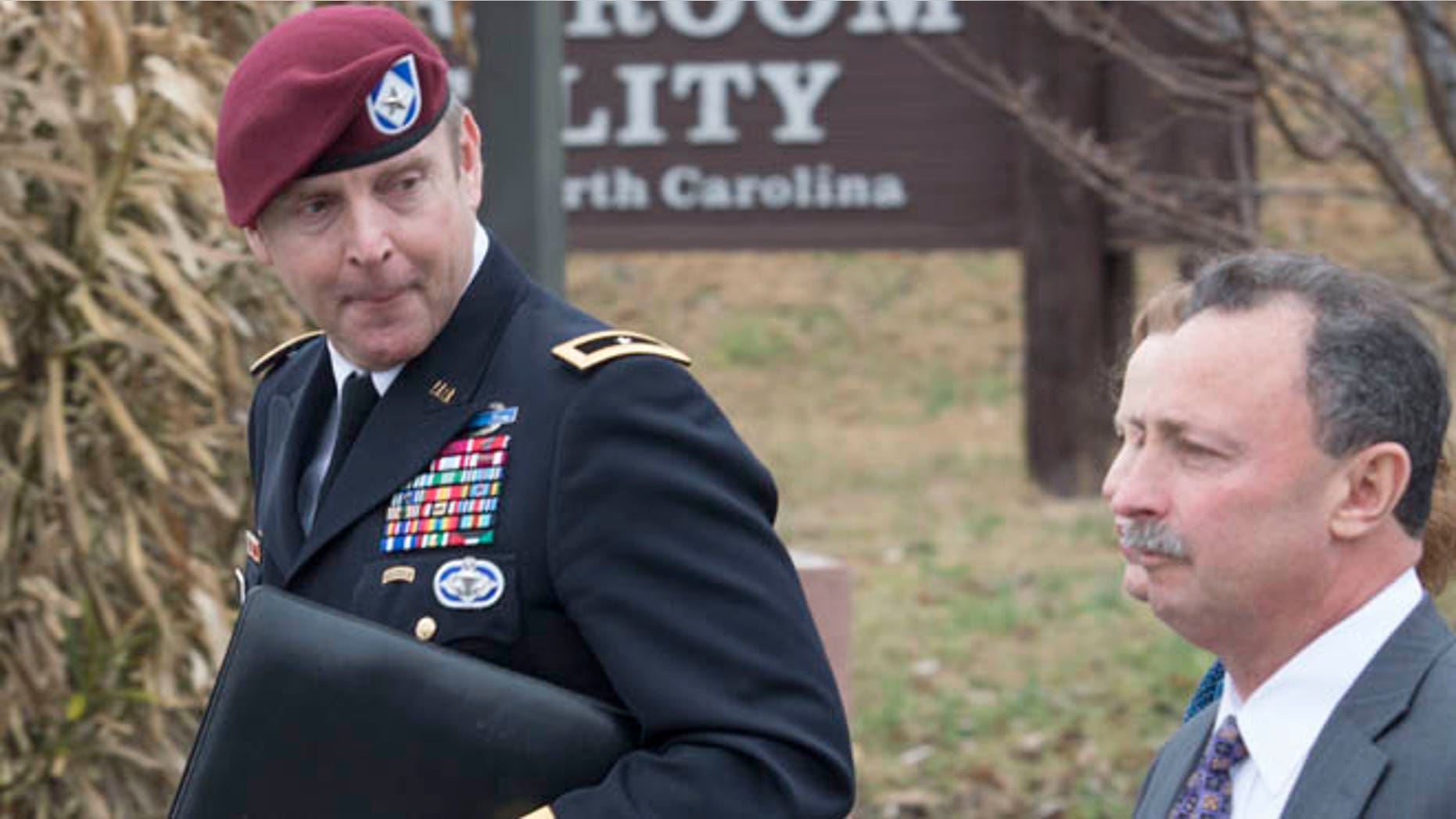 March 17, 2014: Brig. Gen. Jeffrey Sinclair, left, leaves the Fort Bragg courthouse with his defense attorney Richard Scheff.