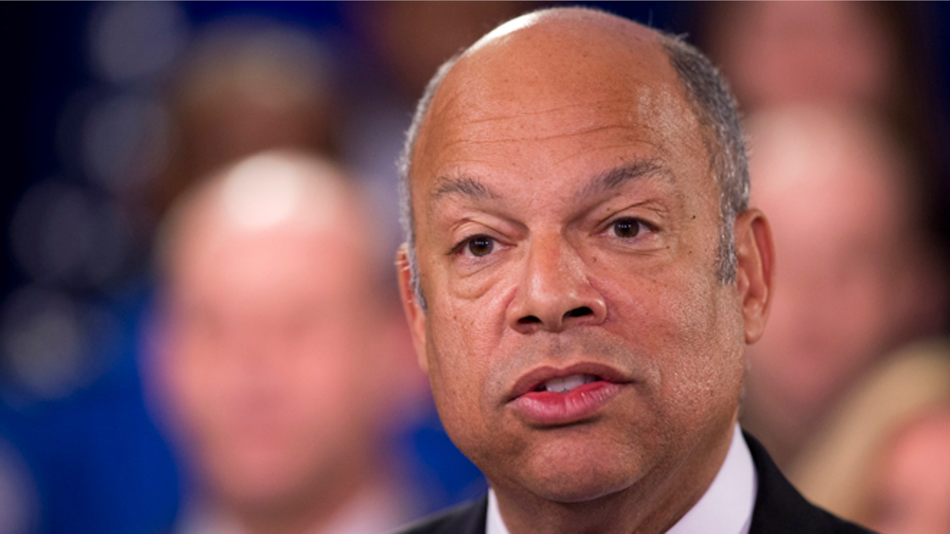 Homeland Security Secretary Jeh Johnson, joined by the department employees, during a news conference in Washington, Monday, Feb. 23, 2015. A partial shutdown of the Homeland Security Department loomed at weekâs end, but no solution was in sight as senators returned to the Capitol from a week-long recess Monday to confront an impasse over the issue. (AP Photo/Manuel Balce Ceneta)