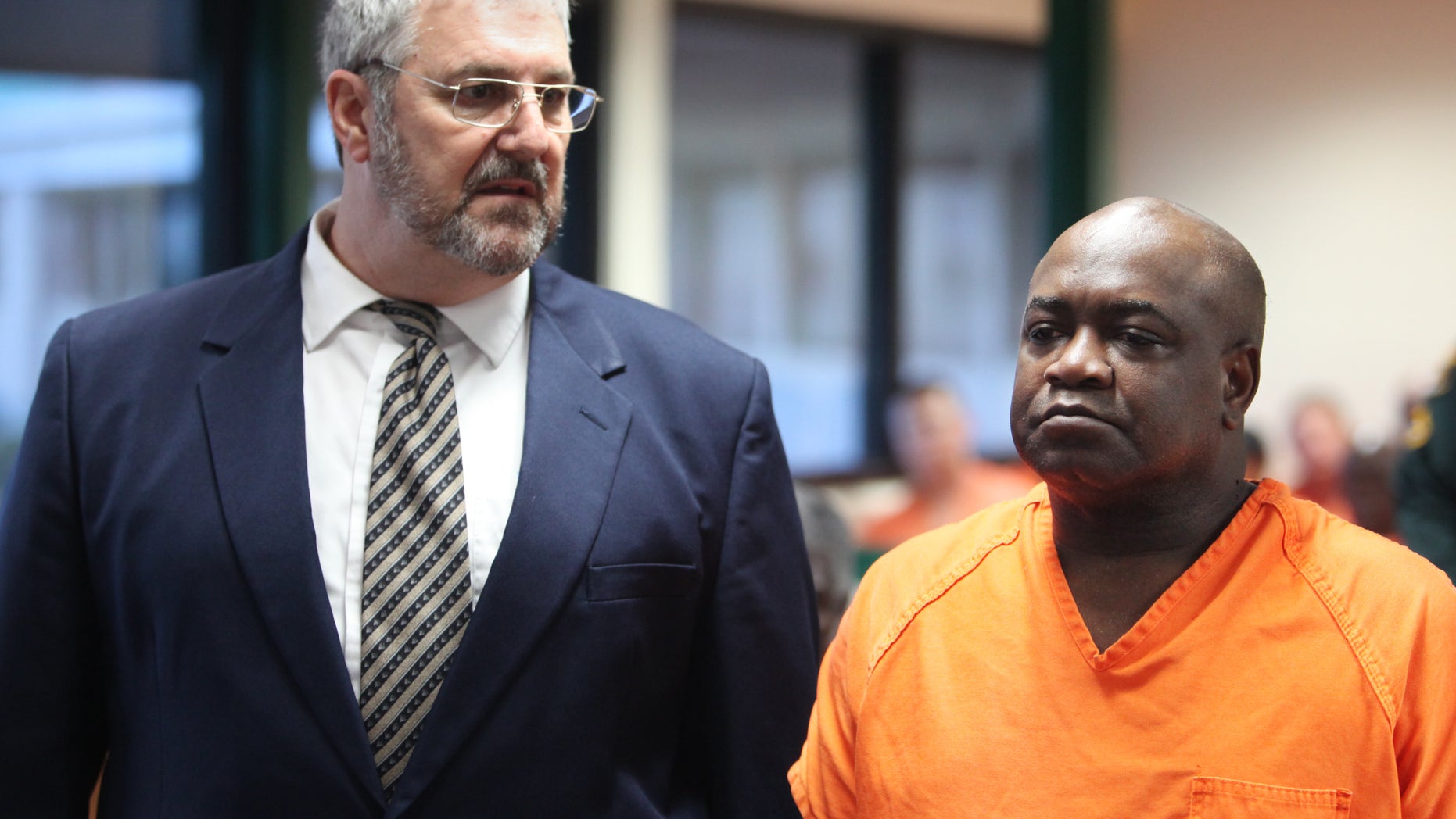 September 19: Assistant Public Defender Robert Trogolo, left, stands next to Jeremiah Fogle, 57, during Fogle's first appearance in front of County Judge Susan Barber Flood, in Bartow, Florida. Fogle has been charged with first-degree murder of his wife Theresa Fogle, 56, and three counts of attempted murder and shooting into an occupied dwelling.