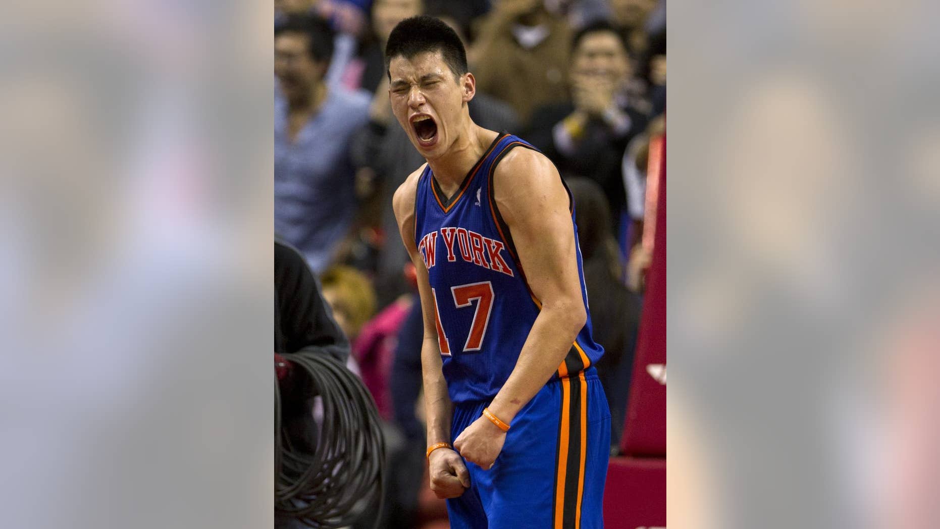 New York Knicks guard Jeremy Lin celebrates his game-winning 3-pointer in the final seconds of an NBA basketball game against the Toronto Raptors in Toronto on Tuesday, Feb. 14, 2012. The Knicks won 90-87. (AP Photo/The Canadian Press, Frank Gunn)