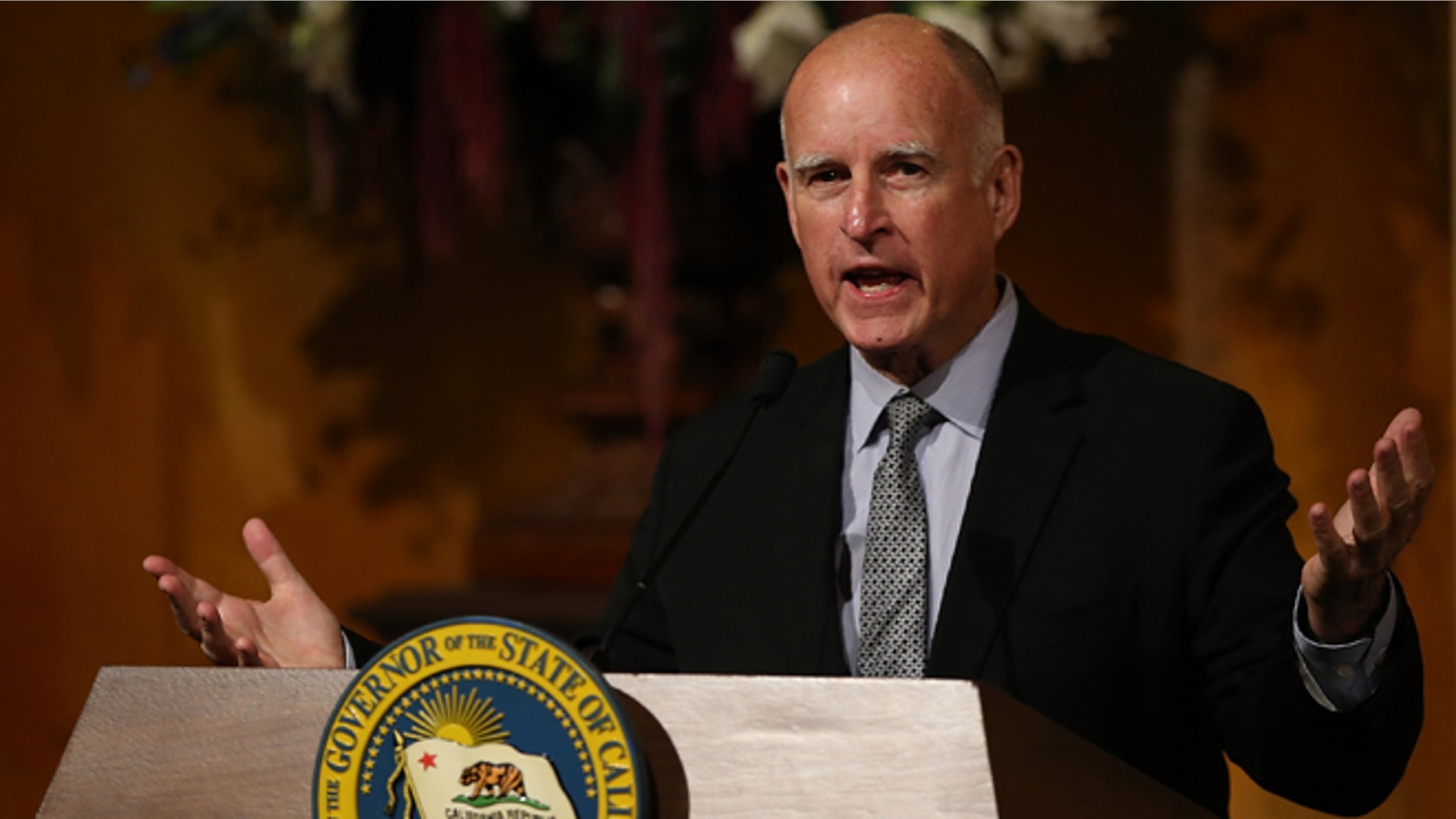California Gov. Jerry Brown speaks during an portrait unveiling ceremony in the Rotunda of the State Capitol on September 8, 2014, in Sacramento, (Photo by Justin Sullivan/Getty Images)