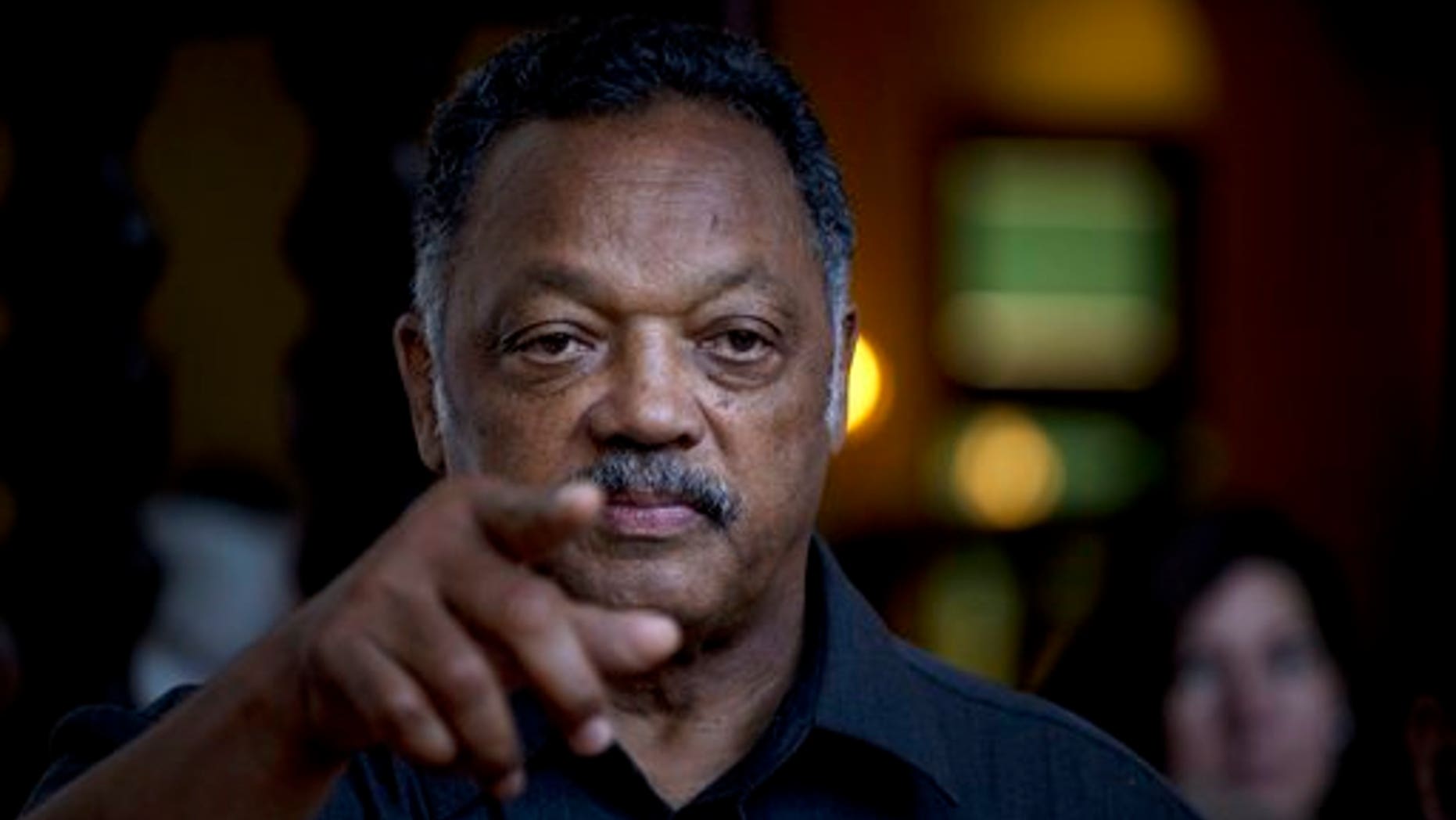 Rev. Jesse Jackson points to a reporter as he takes questions during an impromptu news conference at the Hotel Nacional in Havana, Cuba, Saturday, Sept. 28, 2013. Jackson accepted a request on Saturday by the Revolutionary Armed Forces of Colombia, or FARC, to oversee the release of a U.S. citizen Kevin Scott Sutay kidnapped in June. Jackson says he is in town for talks with religious leaders about their concerns for the poor, and peaceful relations between Cuba, the United States and the rest of the Caribbean. (AP Photo/Ramon Espinosa)