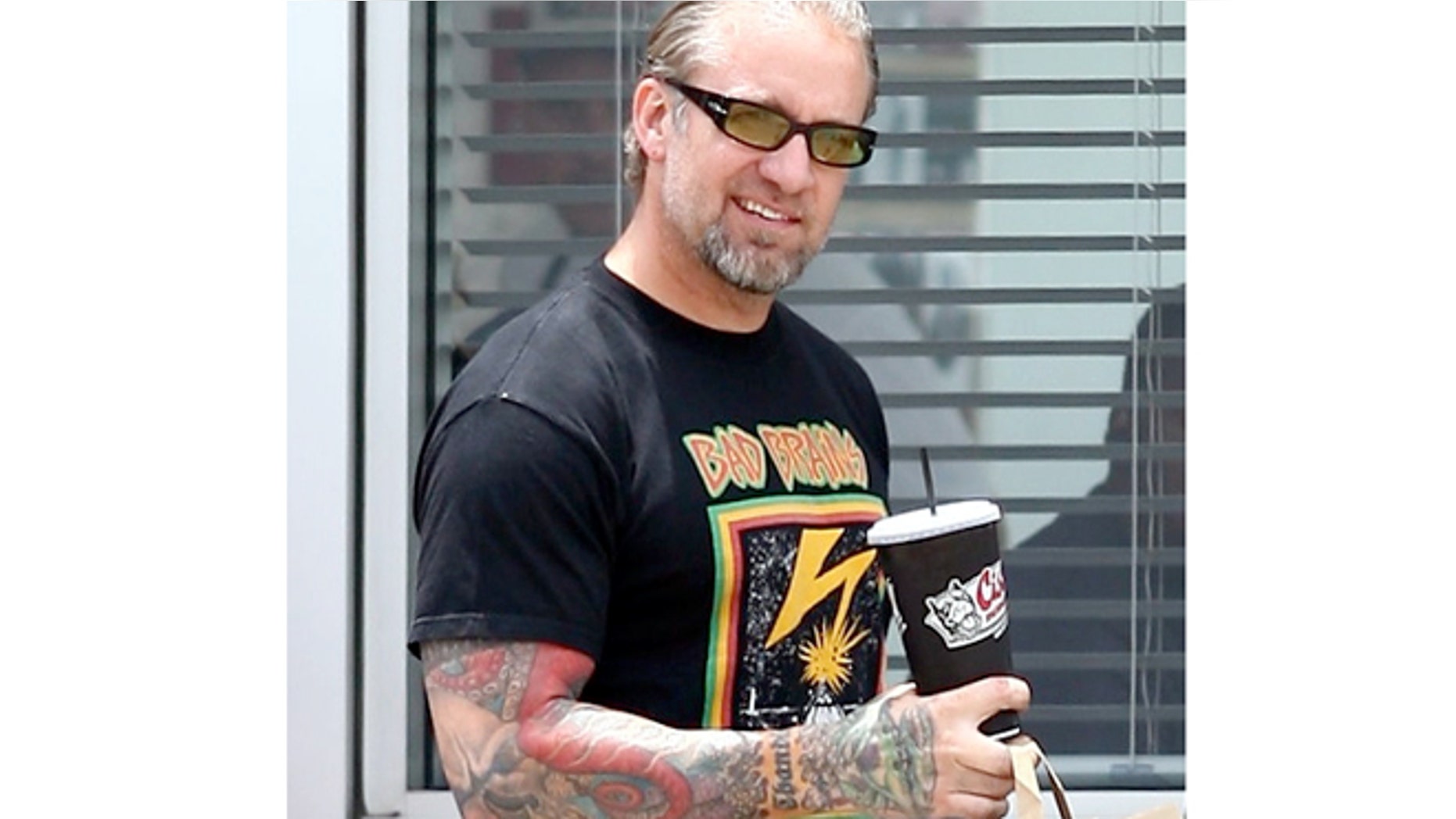 Jesse James and friends leaving his restaurant. May 27, 2010