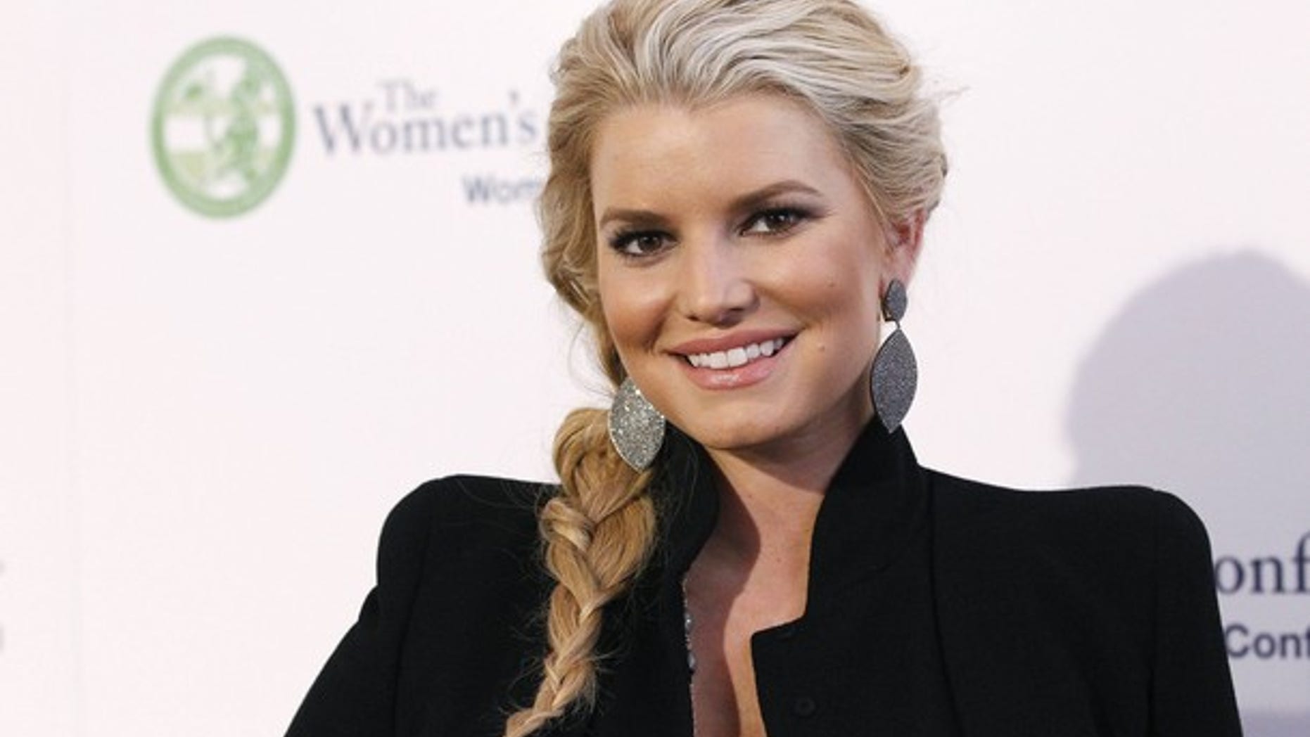 Actress Jessica Simpson poses at The Women's Conference in Long Beach, California October 26, 2010. REUTERS/Mario Anzuoni (UNITED STATES - Tags:ENTERTAINMENT)