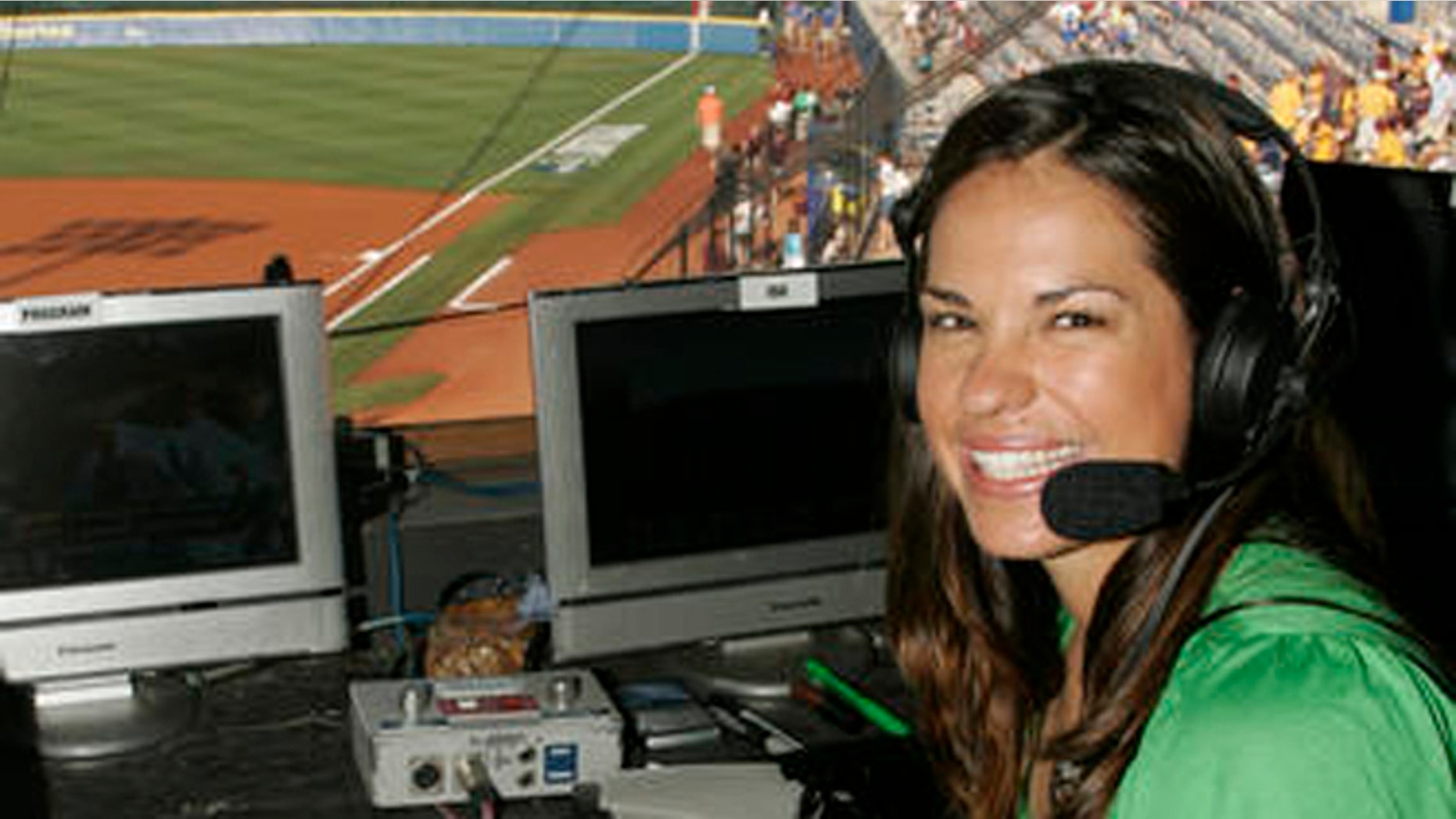 FILE - In this May 29, 2009 file photo, USA softball player Jessica Mendoza poses for a photo in the ESPN broadcast booth at the Women's College World Series in Oklahoma City. Mendoza chatted up Kyle Schwarber, broke down pitcher's tendencies and dealt with social media criticism in her historic first full season covering baseball for ESPN. Mendoza recently shuttled between Cleveland and Chicago, giving World Series updates eight times a day for "Baseball Tonight" and "Sports Center."(AP Photo)