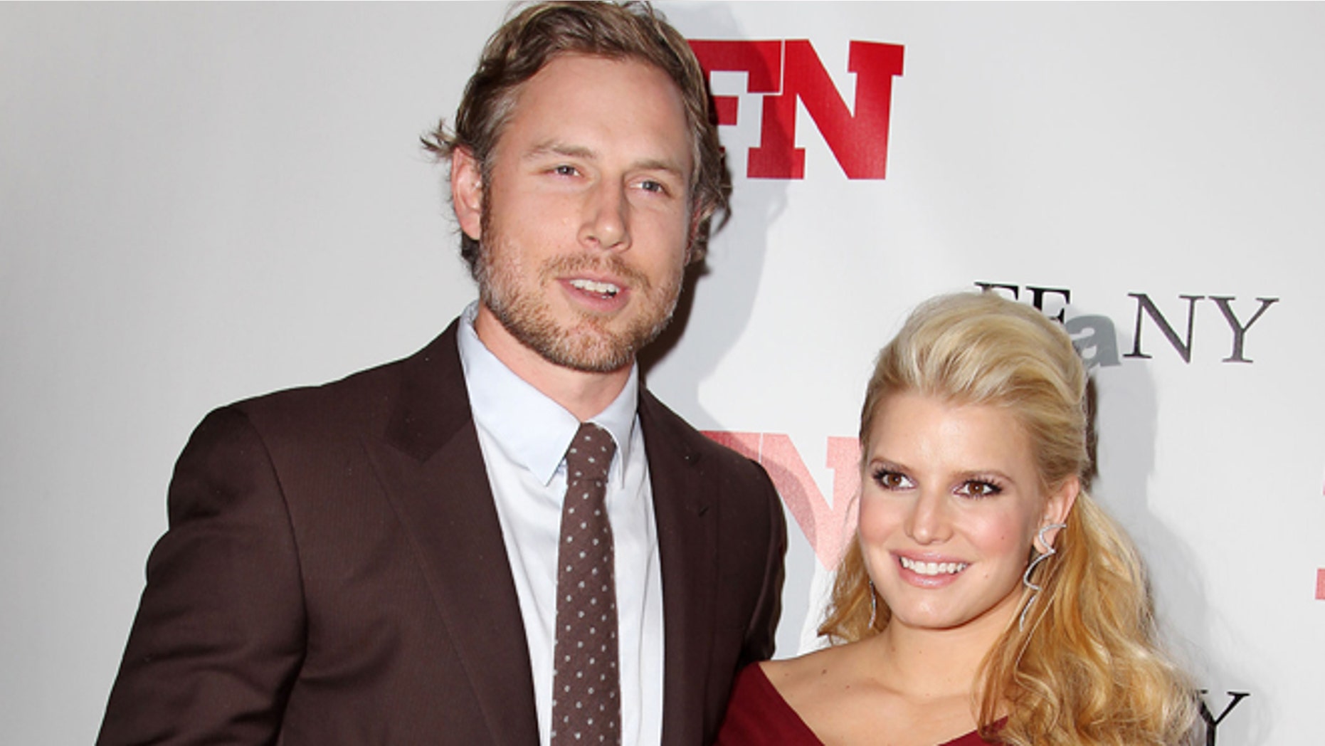 Nov. 29, 2011: In this file photo, singer Jessica Simpson, right, poses with Eric Johnson at the 25th Annual Footwear News Achievement Awards at The Museum of Modern Art in New York.