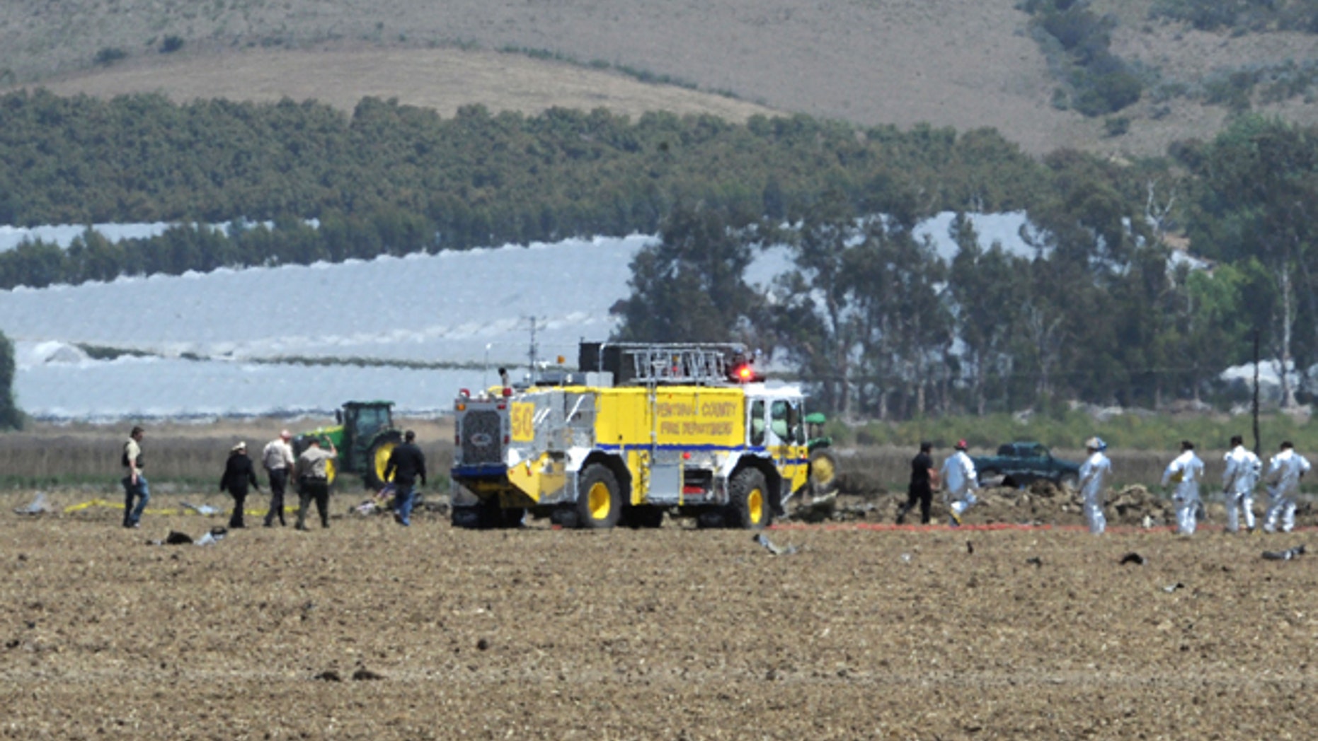 May 18, 2012: Ventura County firefighters and other emergency response personnel work amidst the wreckage of a Hawker Hunter, a single-seat fighter/ground attack monoplane, that crashed about 12:15 p.m. in a field off Broome Ranch Road between CSU Channel Islands in Camarillo and Point Mugu, Calif.