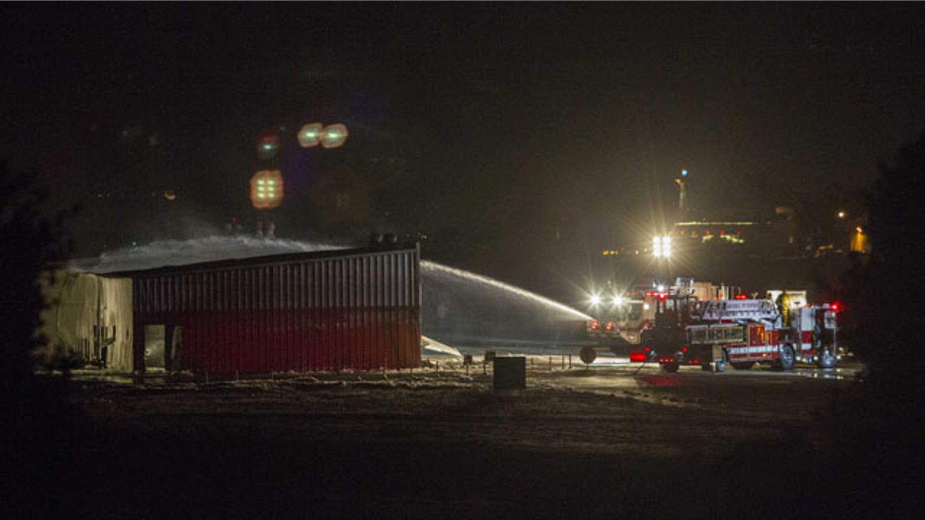 September 29, 2013: Firefighters work to extinguish fire at the site of a plane crash in Santa Monica, Calif. (AP Photo)