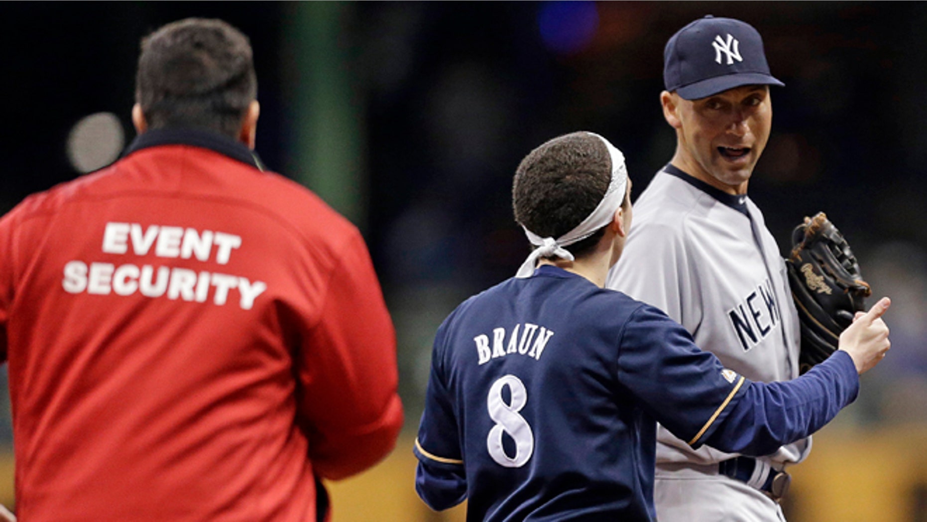 May 9: A fan runs out on the field to New York Yankees' Derek Jeter in the sixth inning of a baseball game against the Brewers in Milwaukee.