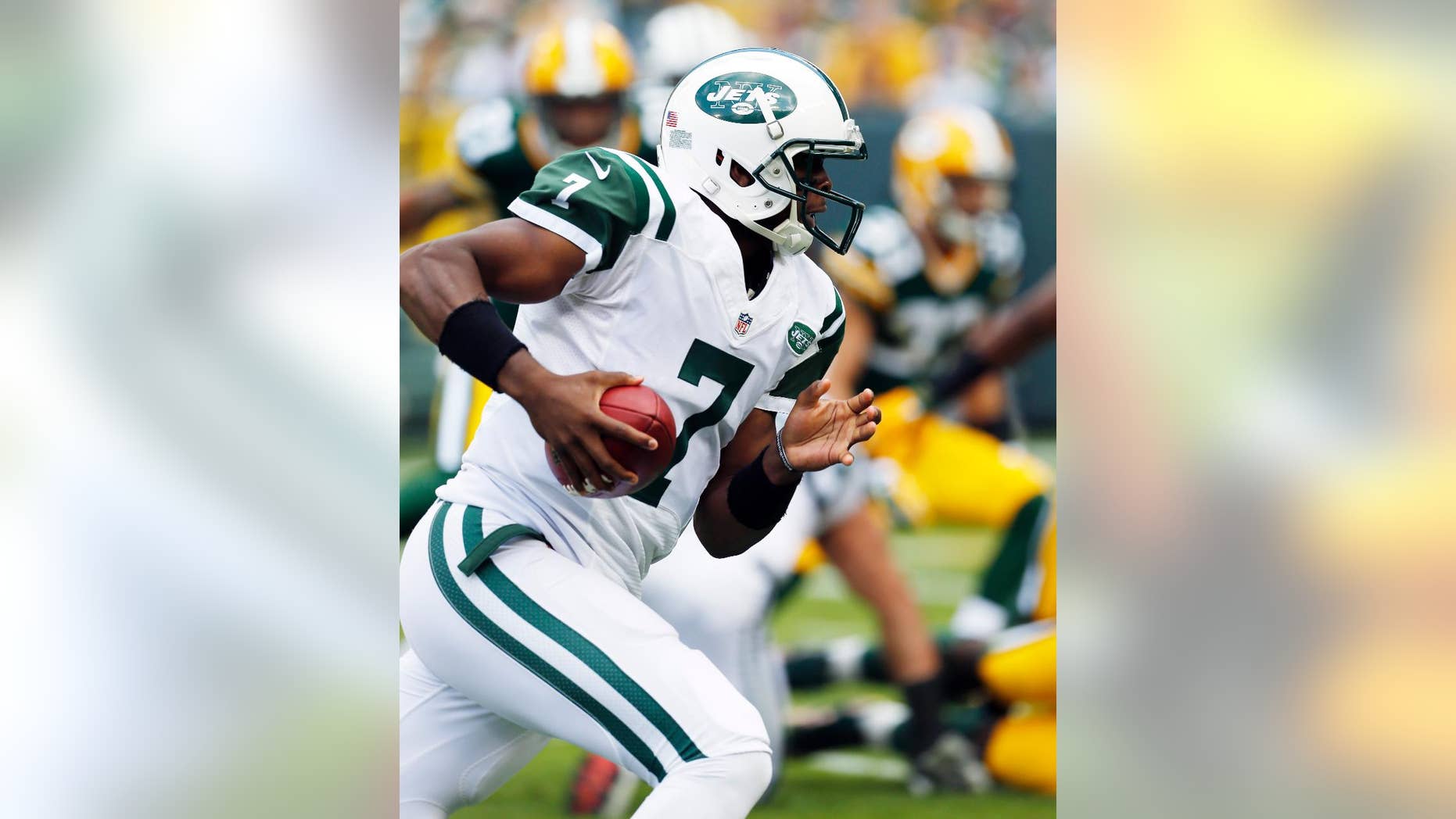 Green Bay Packers' Aaron Rodgers celebrates after throwing a touchdown pass during the second half of an NFL football game against the New York Jets Sunday, Sept. 14, 2014, in Green Bay, Wis. (AP Photo/Tom Lynn)